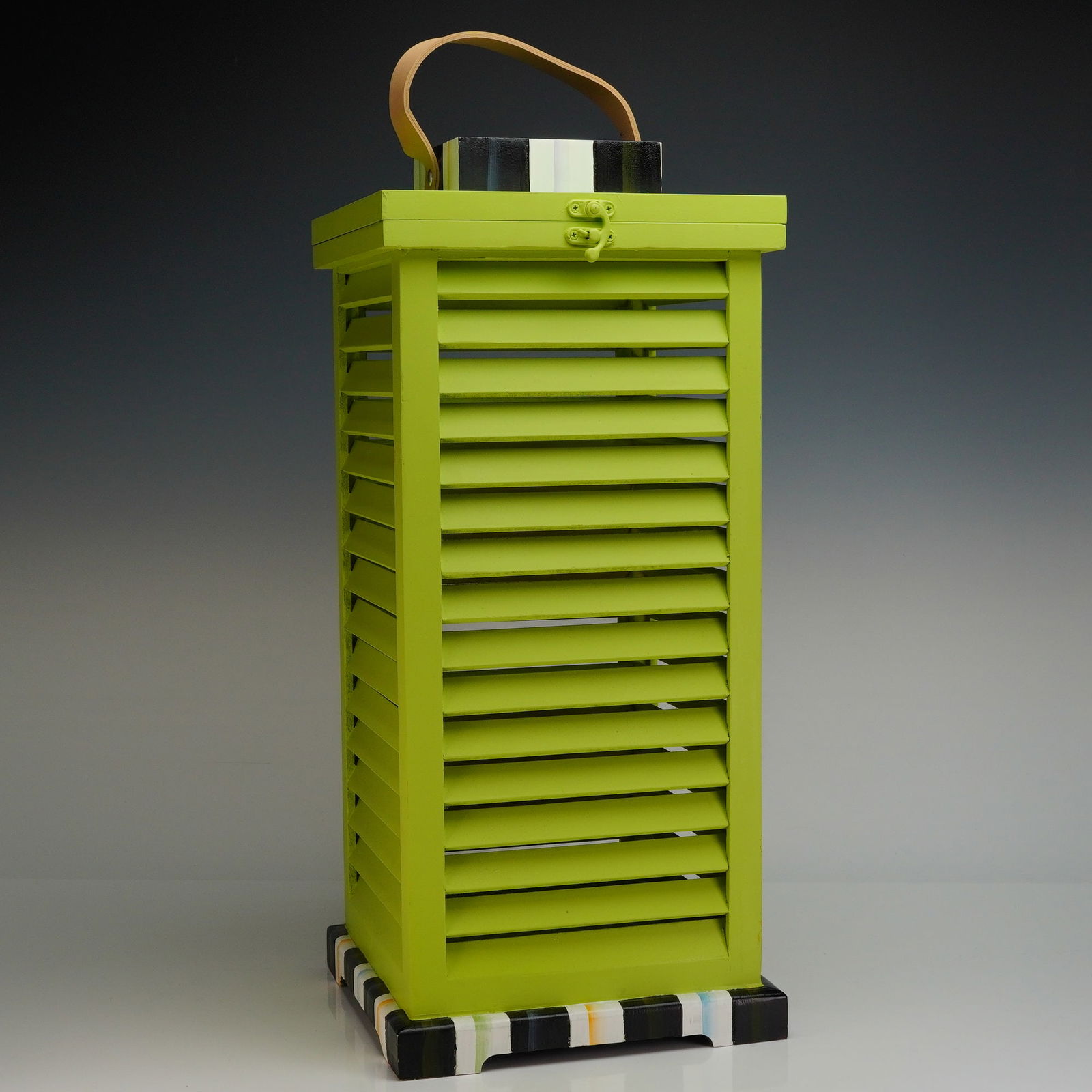 MacKenzie Childs Large Shutter Lantern, Chartreuse: The object is constructed of painted wood or composite material, styled as a tall, rectangular lantern or storage box. The main body is finished in a vibrant chartreuse (lime green) paint and features