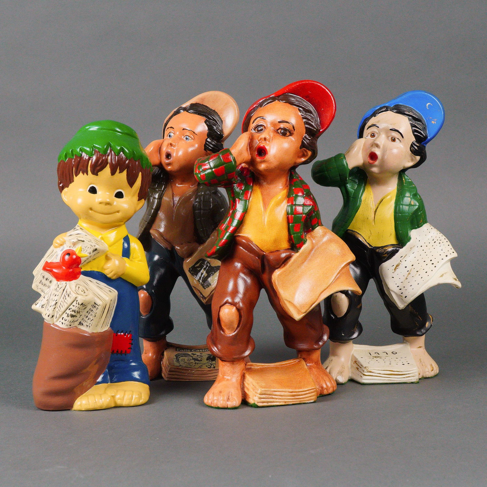 A Group of Four Ceramic Newspaper Boy Figurines, N. Cox, Dated 1970 (1 of 5)
