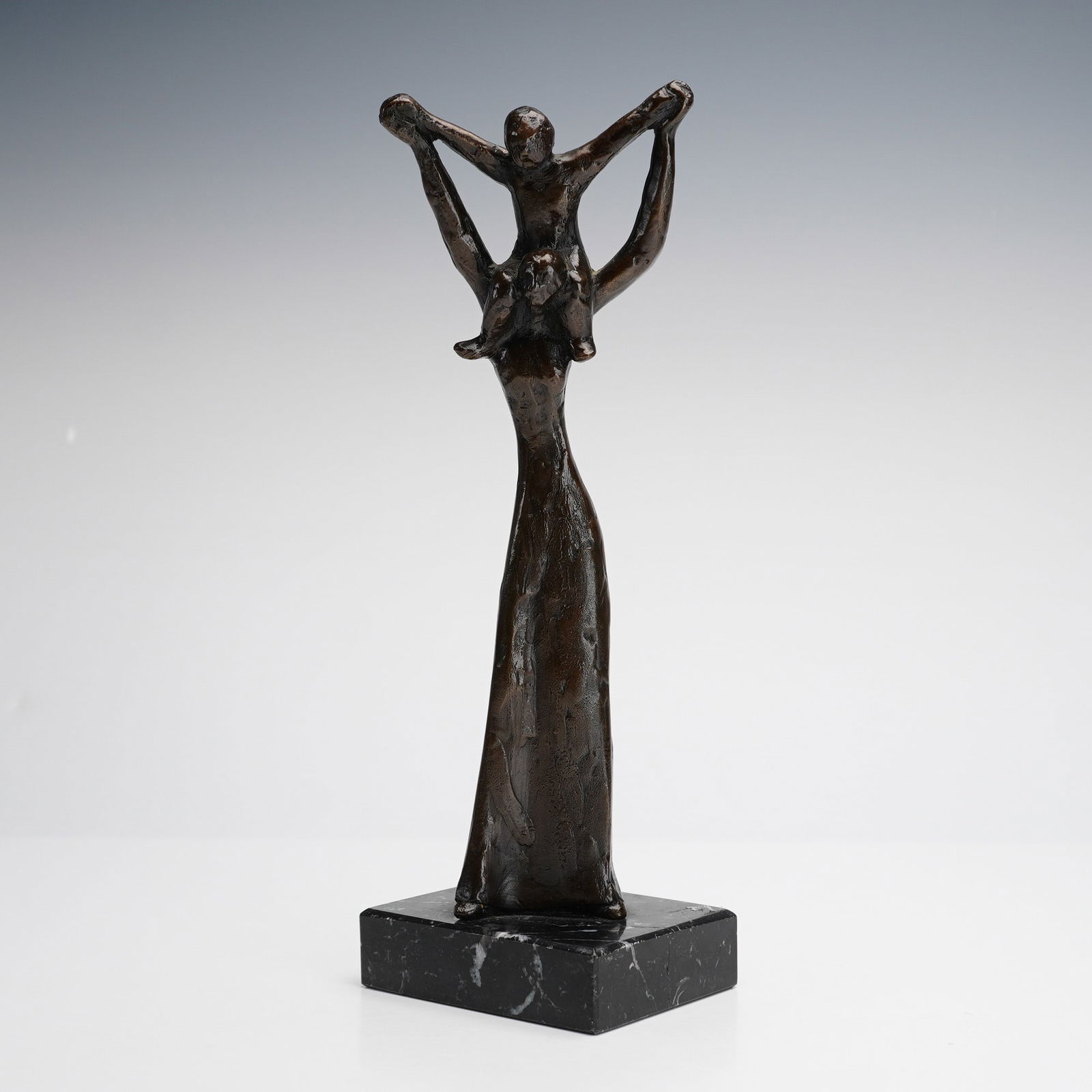 Esther Wertheimer Bronze on Marble base, Shoulder Ride, Signed: This finely cast work captures a tender, expressive moment rendered in Wertheimer's distinctive figurative style, with warm bronze patina and careful attention to form and movement. The solid marble b