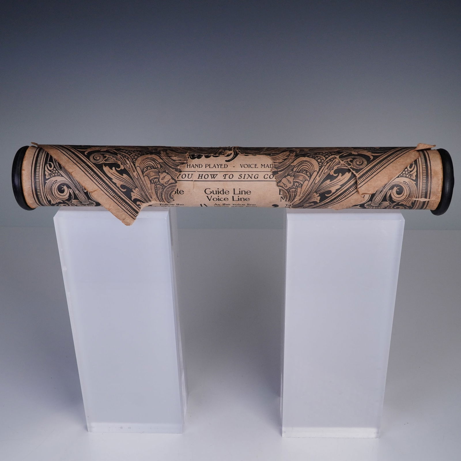 Vocalstyle Player Piano Song Roll - Shows You How to Sing Correctly: Vocalstyle player piano song roll. A vintage 12-inch paper piano roll produced by Vocalstyle Music Company, titled Shows You How to Sing Correctly. This roll is marked No. 12713 and was played by Buck