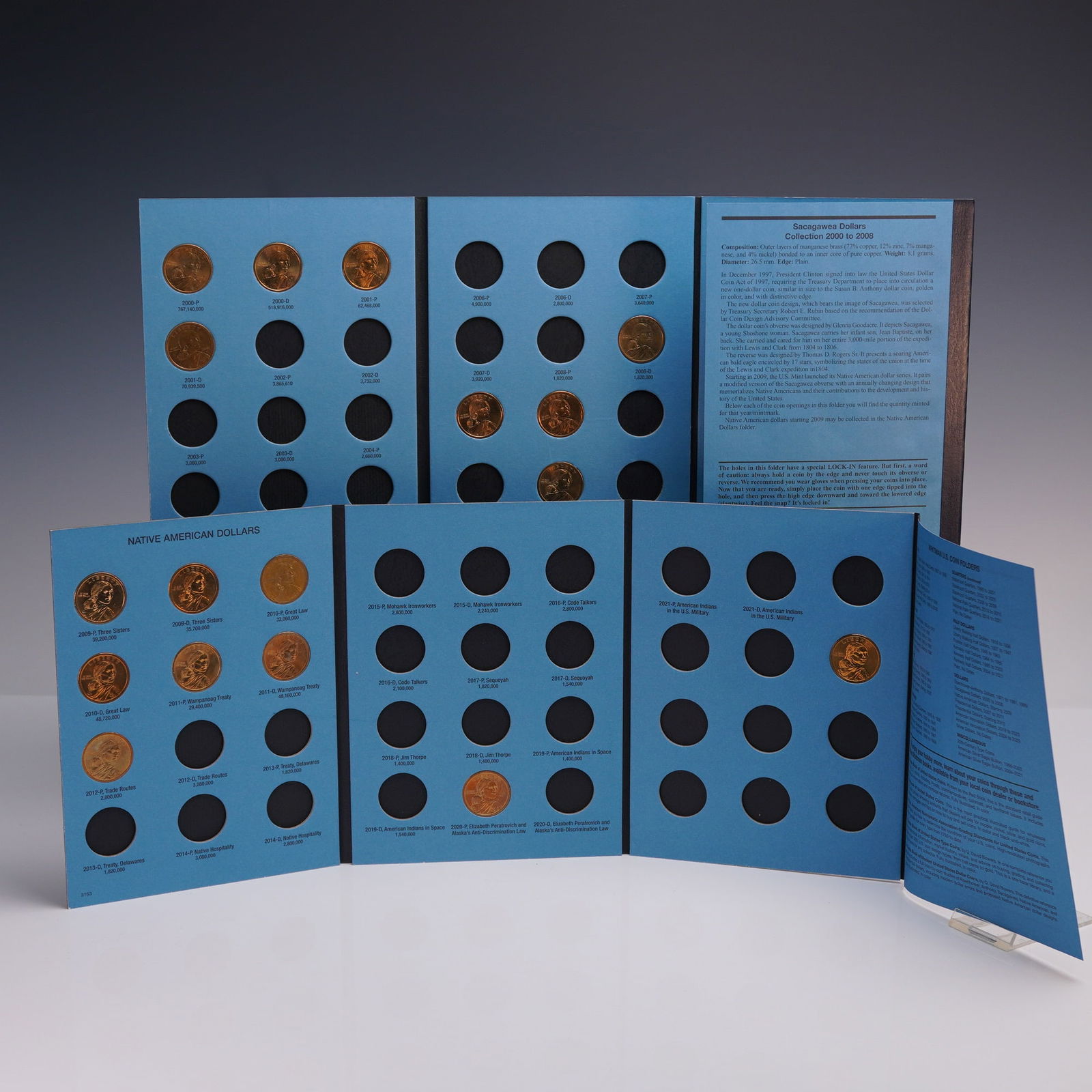 2 Vol. 2000-2008 & 2009-2020 Whitman Coin Folders, Sacagawea Dollars: Two Whitman Official Coin Folders dedicated to United States dollar coins featuring Sacagawea. The first folder is titled SACAGAWEA DOLLARS COLLECTION 2000 TO 2008 and includes labeled slots for 18 co