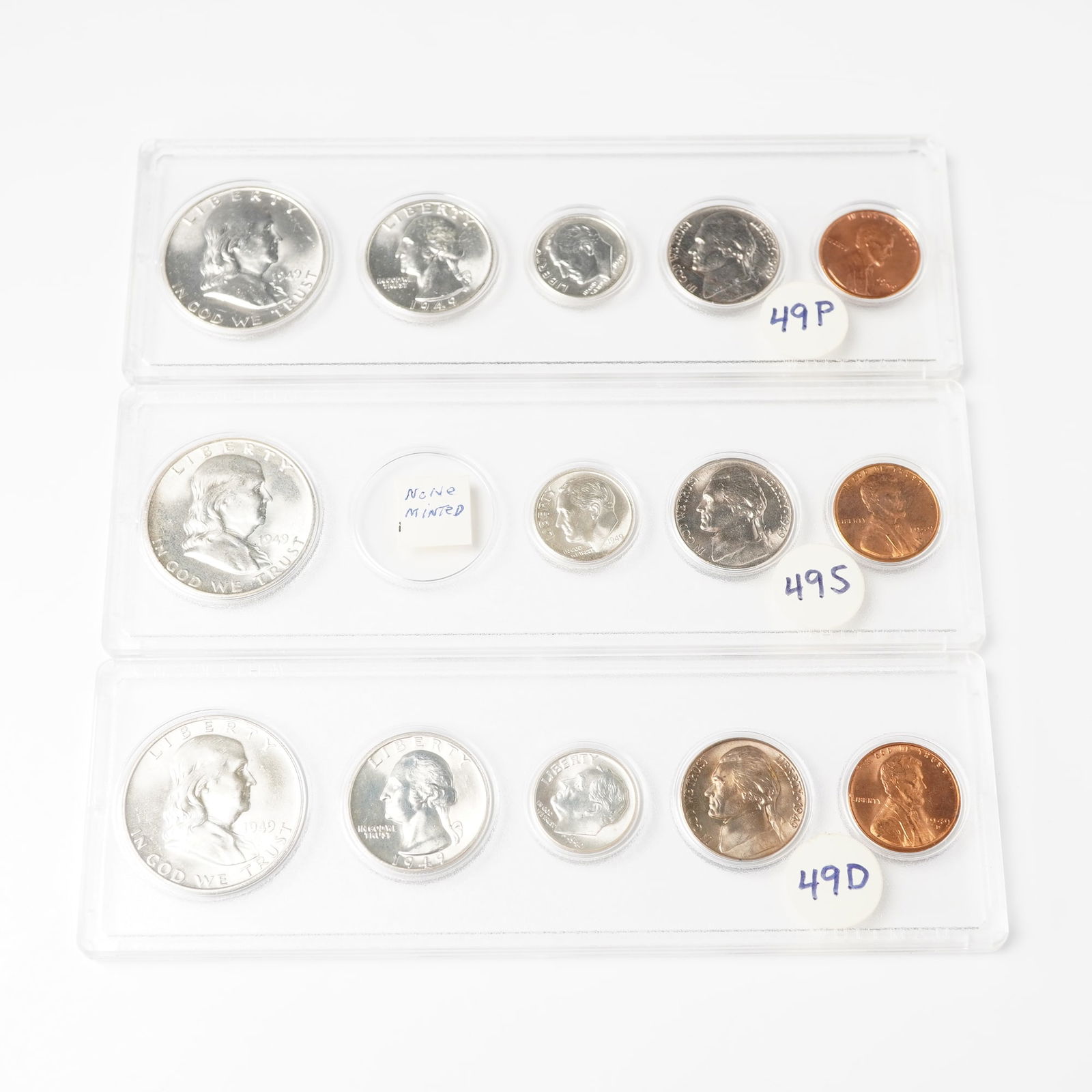 3pc 1949 United States Coin Sets: Two of the sets feature all five standard denomination coins, including Franklin Half Dollar, Washington Quarter, Roosevelt Dime, Jefferson Nickel, and Lincoln Cent with one slab including all coins w