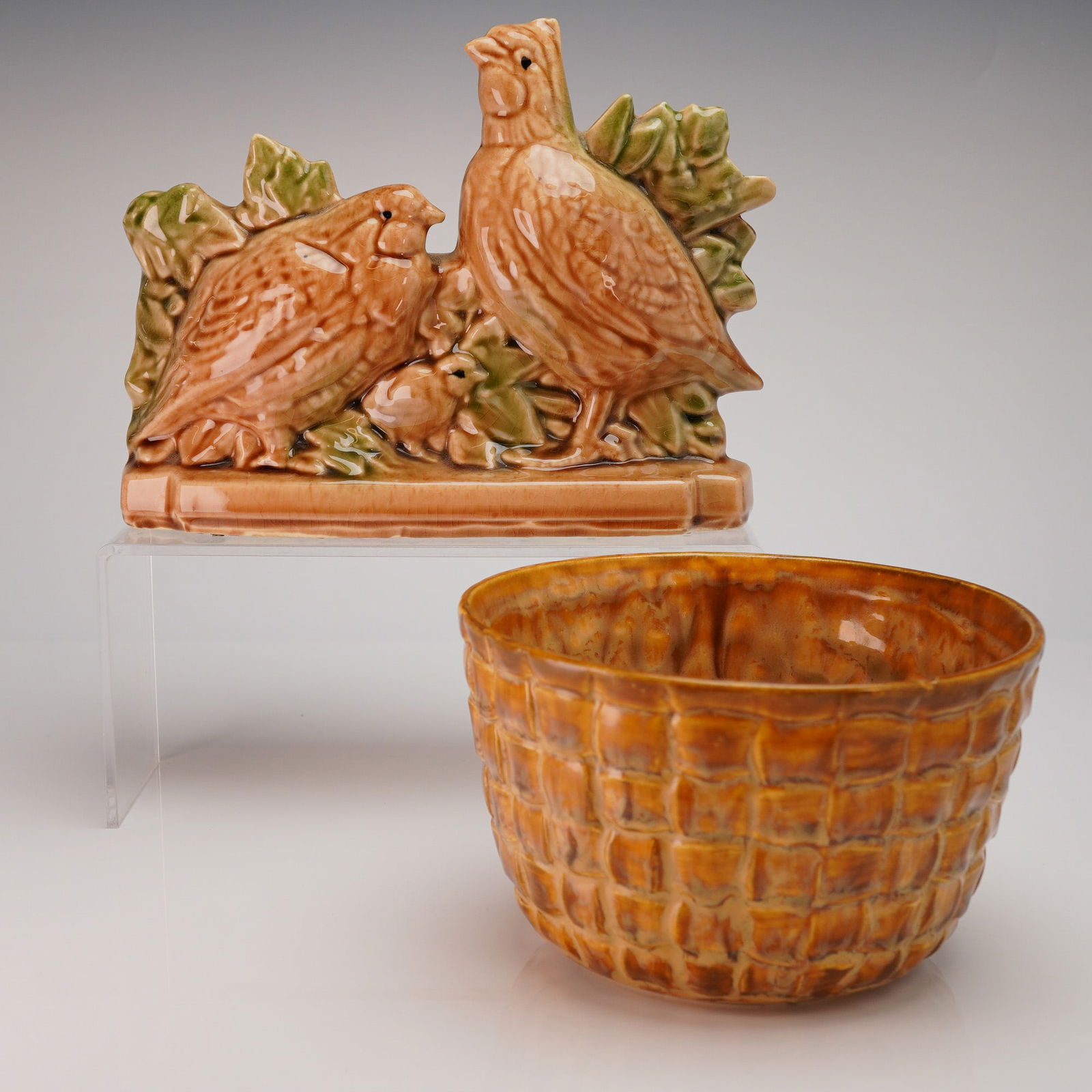 2 McCoy Ceramic Planters - Quail & Basketweave: A pair of vintage McCoy ceramic pottery pieces, consisting of a figural planter and a round bowl. The first item is the McCoy Quail Family Planter, executed in a high-gloss mottled tan, orange, and br