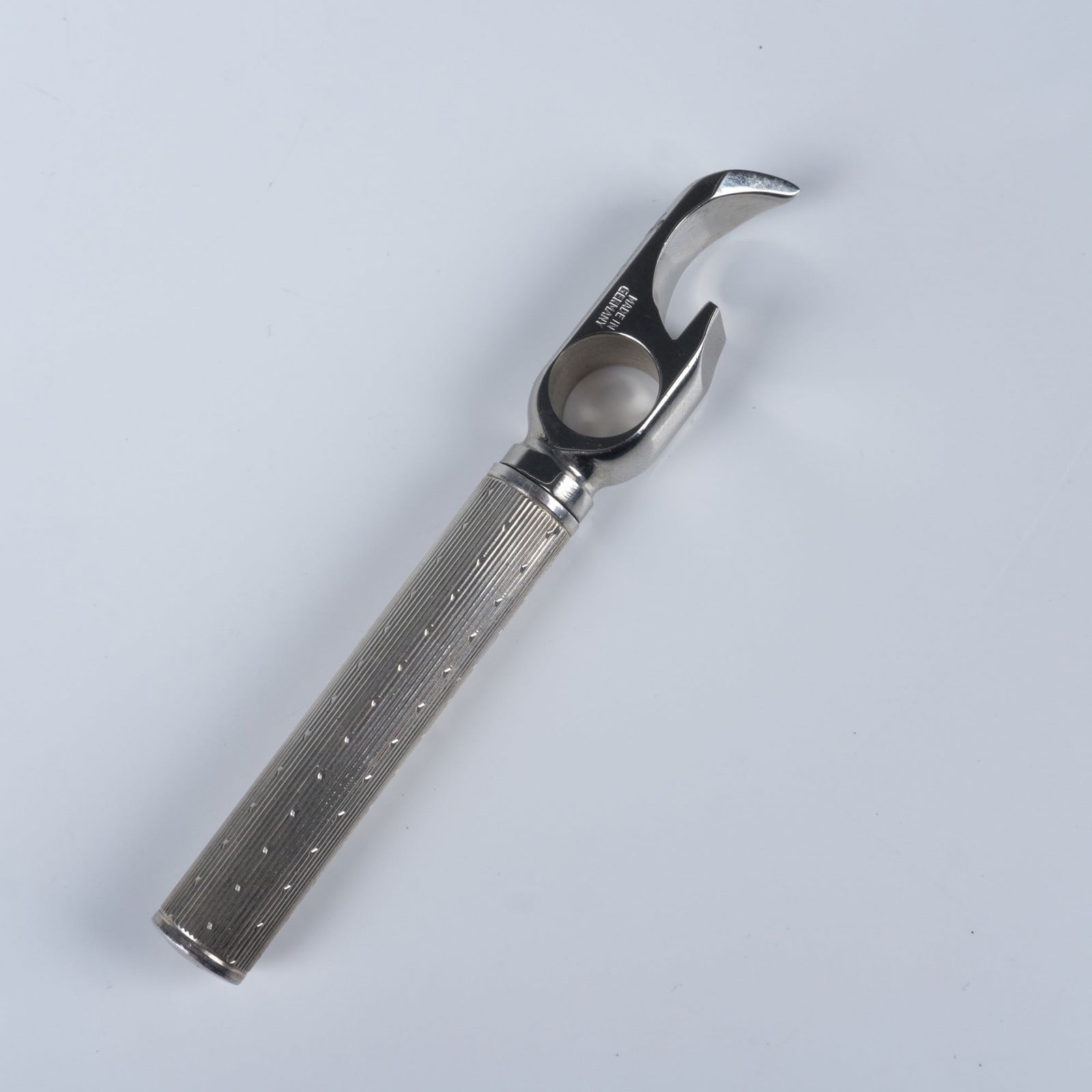 Tiffany & Co Sterling Silver Waiter's Friend Corkscrew and Bottle Opener: Design incorporates three main tools: a corkscrew, a lever, and a bottle opener. Crafted with a sterling silver textured handle and a sturdy steel head, marked Sterling Tiffany & Co Made in Germany.