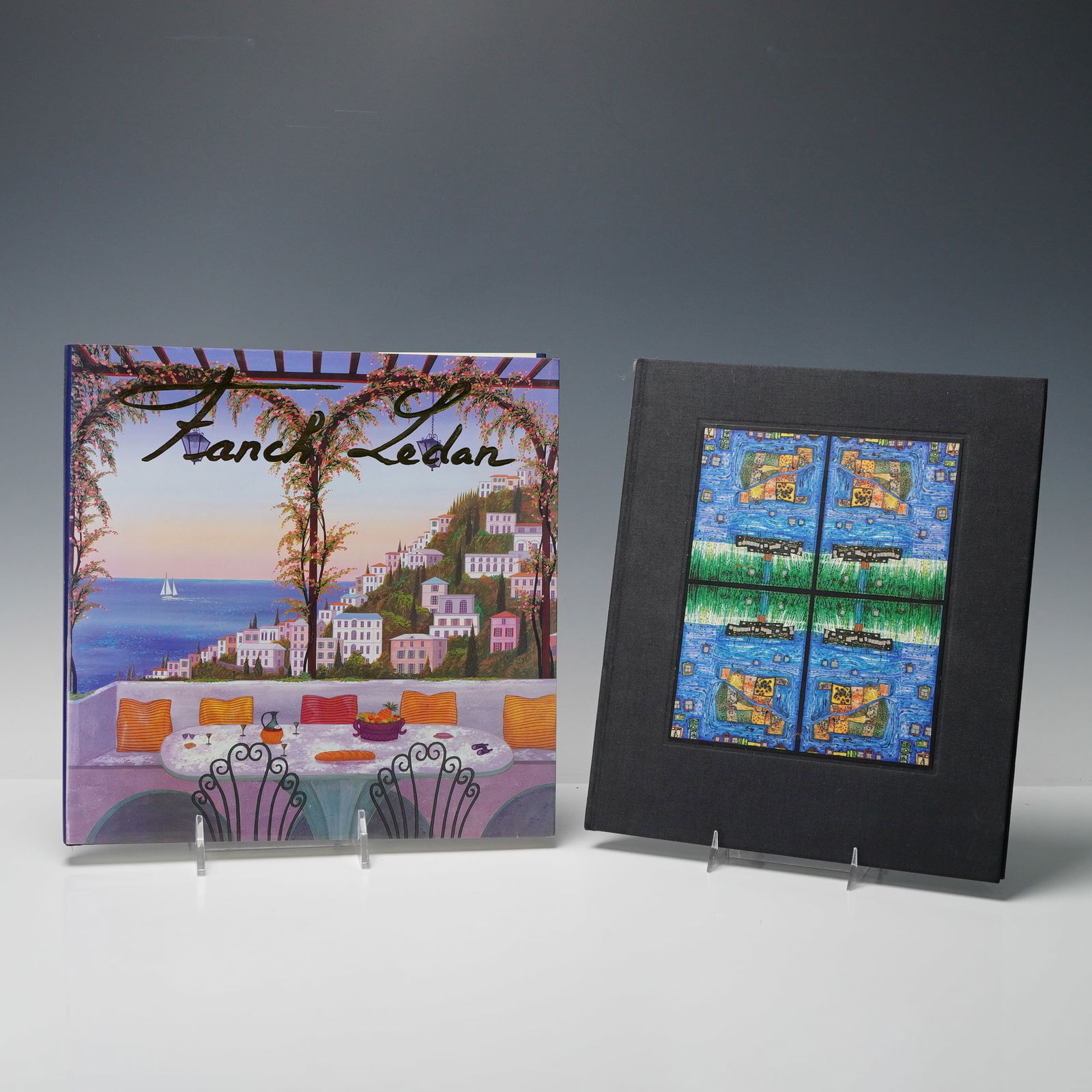 2 Art Hardcover Books: Titles including: Fanch Ledan by Fanch Ledan (1990); Ao Tea Roa: Insel der verlorenen Wuensche (Island of Lost Desire) by Friedensreich Hundertwasser (1979). Dimensions: The dimensions of the collecti
