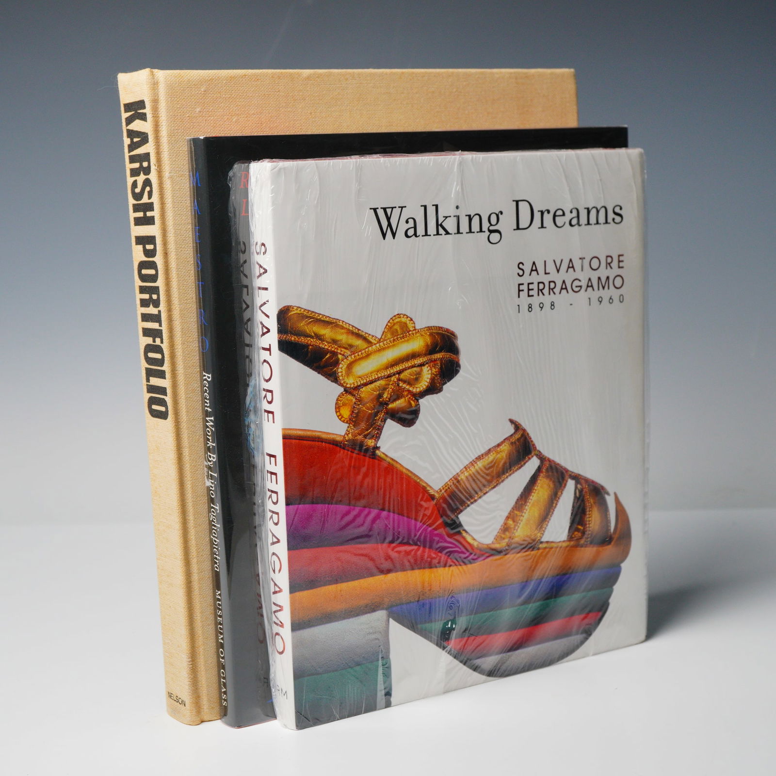 3 Art Hardcover Books, Walking Dreams, Maestro & Karsh Portfolio: Collection of three books. Includes "Walking Dreams: Salvatore Ferragamo 1898-1960" by Mercedes Iturbe, a sealed illustrated book documenting the life and work of Italian shoe designer Salvatore Ferra