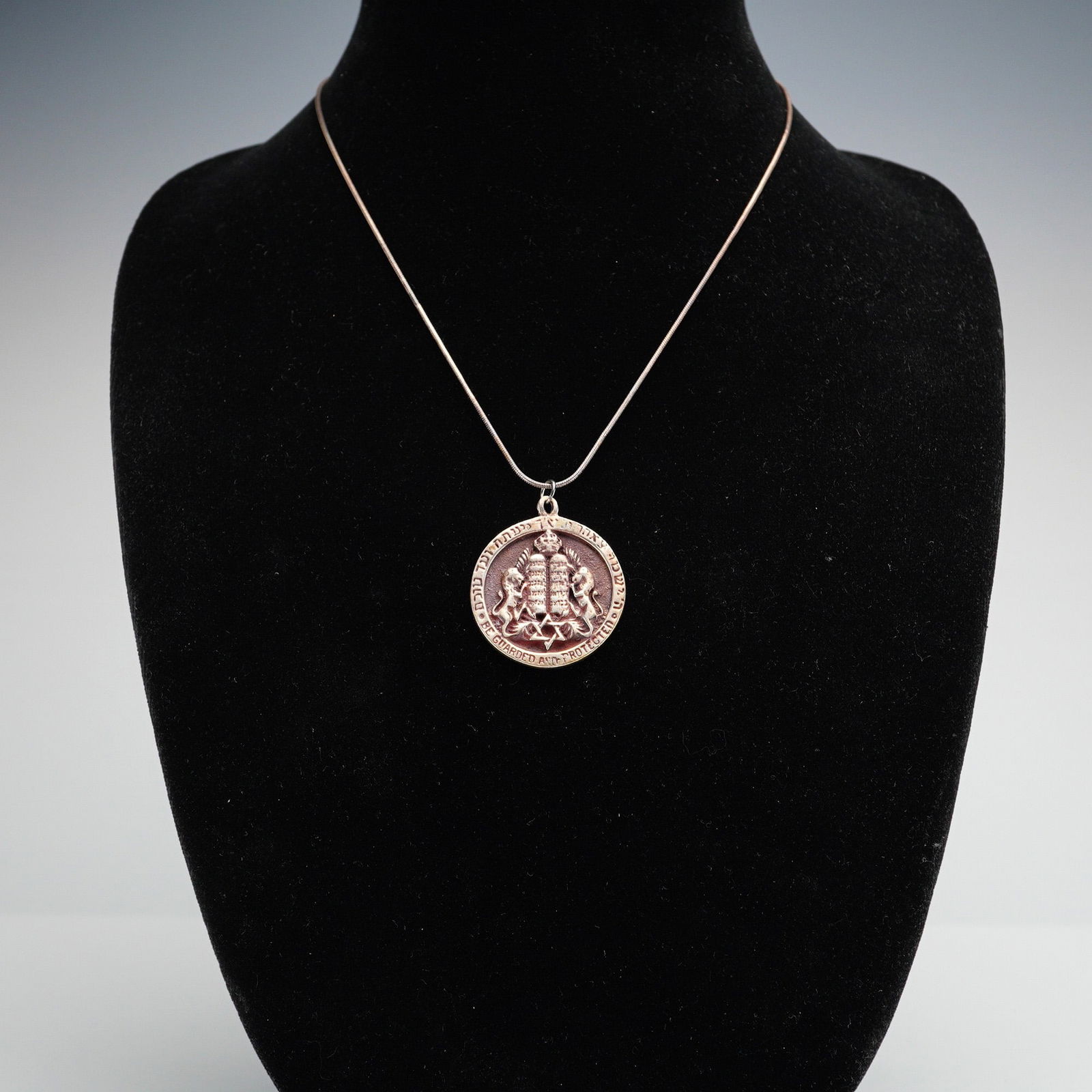 Sterling Silver Star of David & Tablets Pendant Necklace: Pendant extended from thin serpentine chain. Pendant adorned with Judaica blessing - Be Guarded and Protected. Sterling impressed mark. Dimensions: 13.00"L x 1.50"W Weight: 0.70oz