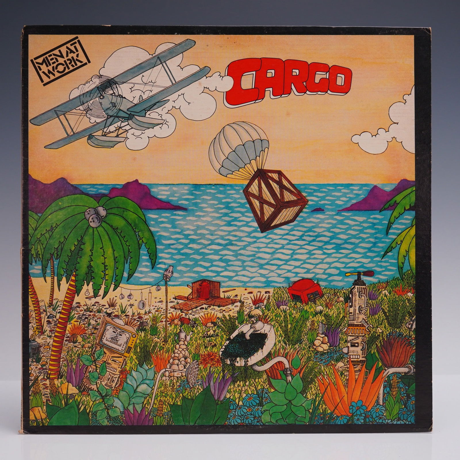 Men at Work LP Record - Cargo, 1983: Men at Work - Cargo vinyl LP album, released in 1983 on Columbia Records (QC 38660). This second studio album from the Australian rock band includes standout tracks such as Overkill, It's a Mistake, a