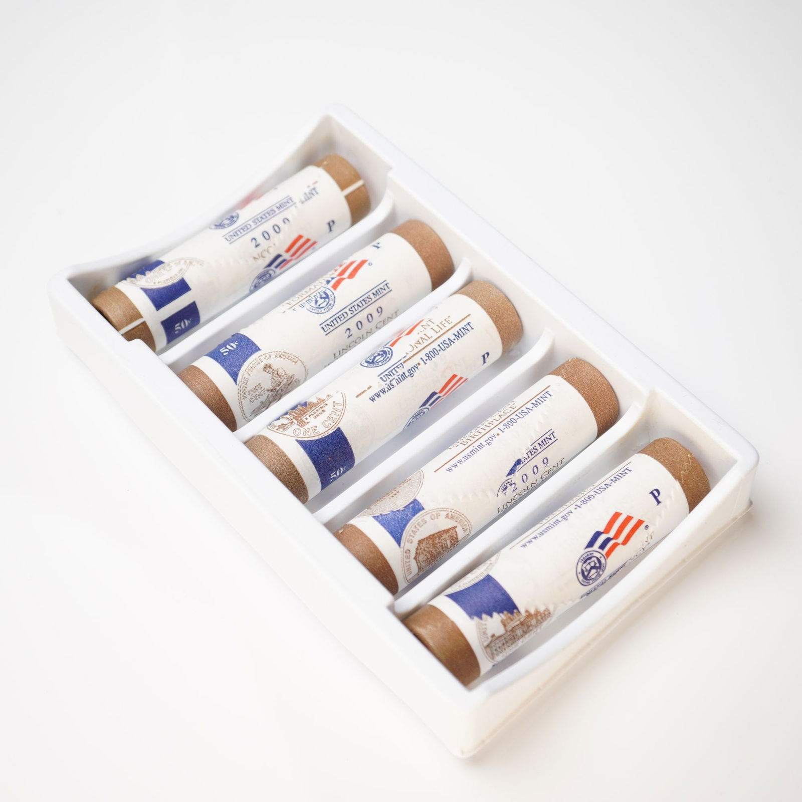 5pc 2009-P Lincoln Cent Commemorative Rolls: Five U.S. Mint rolls of 2009 Lincoln Cents, each featuring a distinct reverse design commemorating stages of Abraham Lincoln's life: Birthplace, Formative Years, Professional Life, and Presidency. Eac