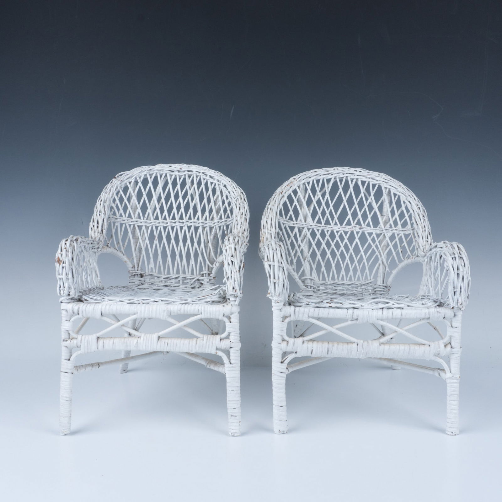 2pc Wicker Doll Furniture, Chairs: White wicker doll chairs. Issued: 20th century Dimensions: 8.5"L x 8"W x 13"H