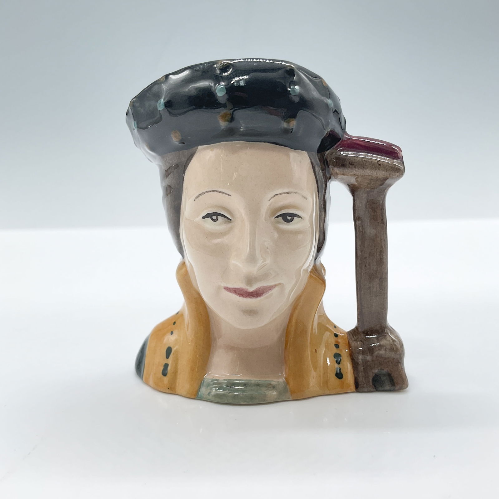 Catherine Parr D6752 - Mini - Royal Doulton Character Jug: Royal Doulton backstamp. Artist: Michael Abberley Issued: 1987 - 1989 Dimensions: 2.5"H Country of Origin: England