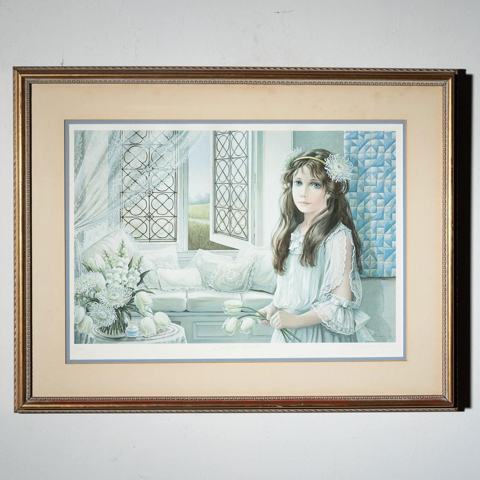 Pati Bannister, Limited Edition Lithograph Window Seat, Signed: A finely detailed limited edition lithograph by Pati Bannister, titled Window Seat, dated 1984. This artwork, numbered 76/950, captures a serene interior scene featuring a young girl in an elegant whi