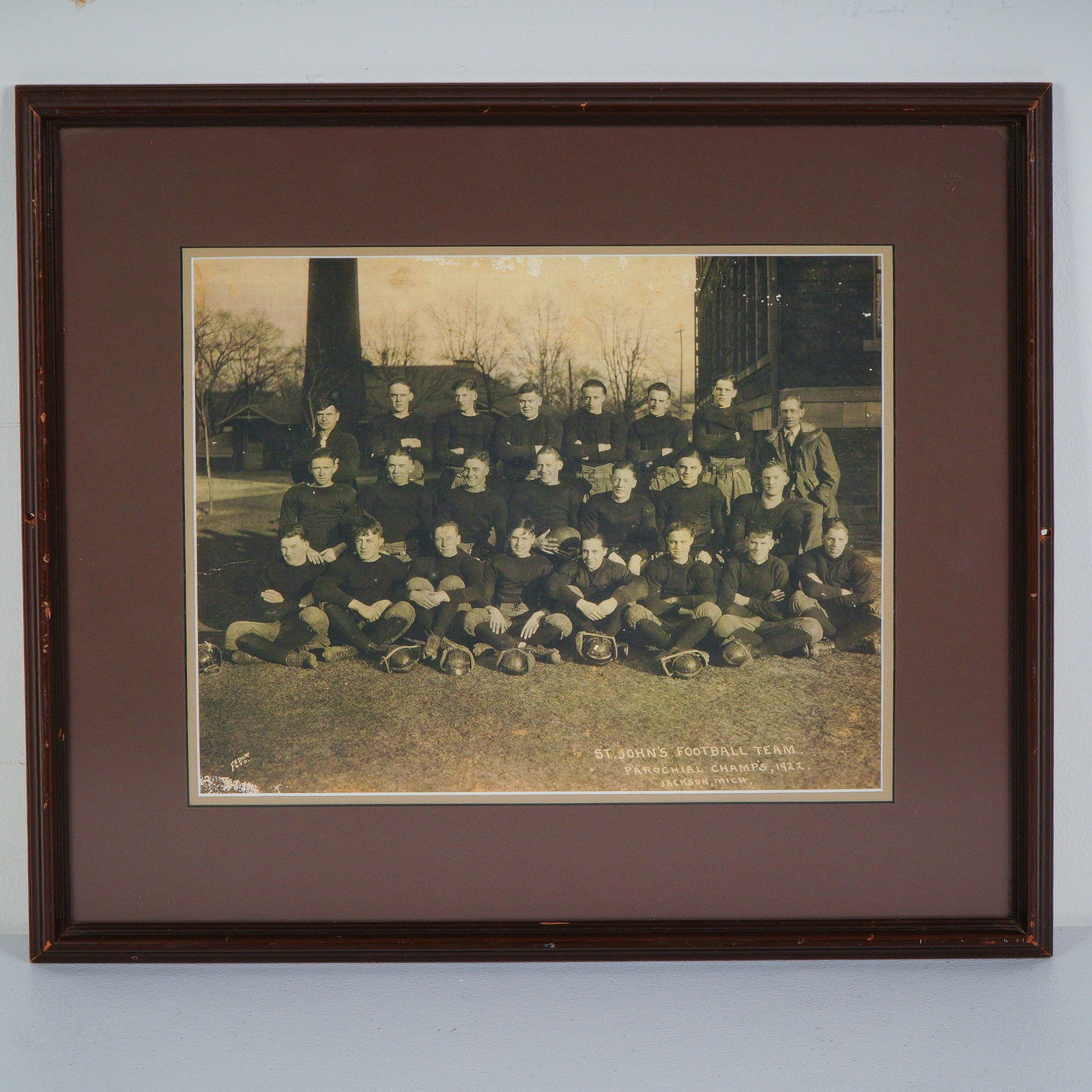 1922 St. Johns Football Team Original Gelatin Photograph by Fedor Foto: A rare and historically rich team photograph of the St. John's Football Team, proudly titled Parochial Champs 1922, Jackson, Mich. This striking original silver gelatin print captures the entire