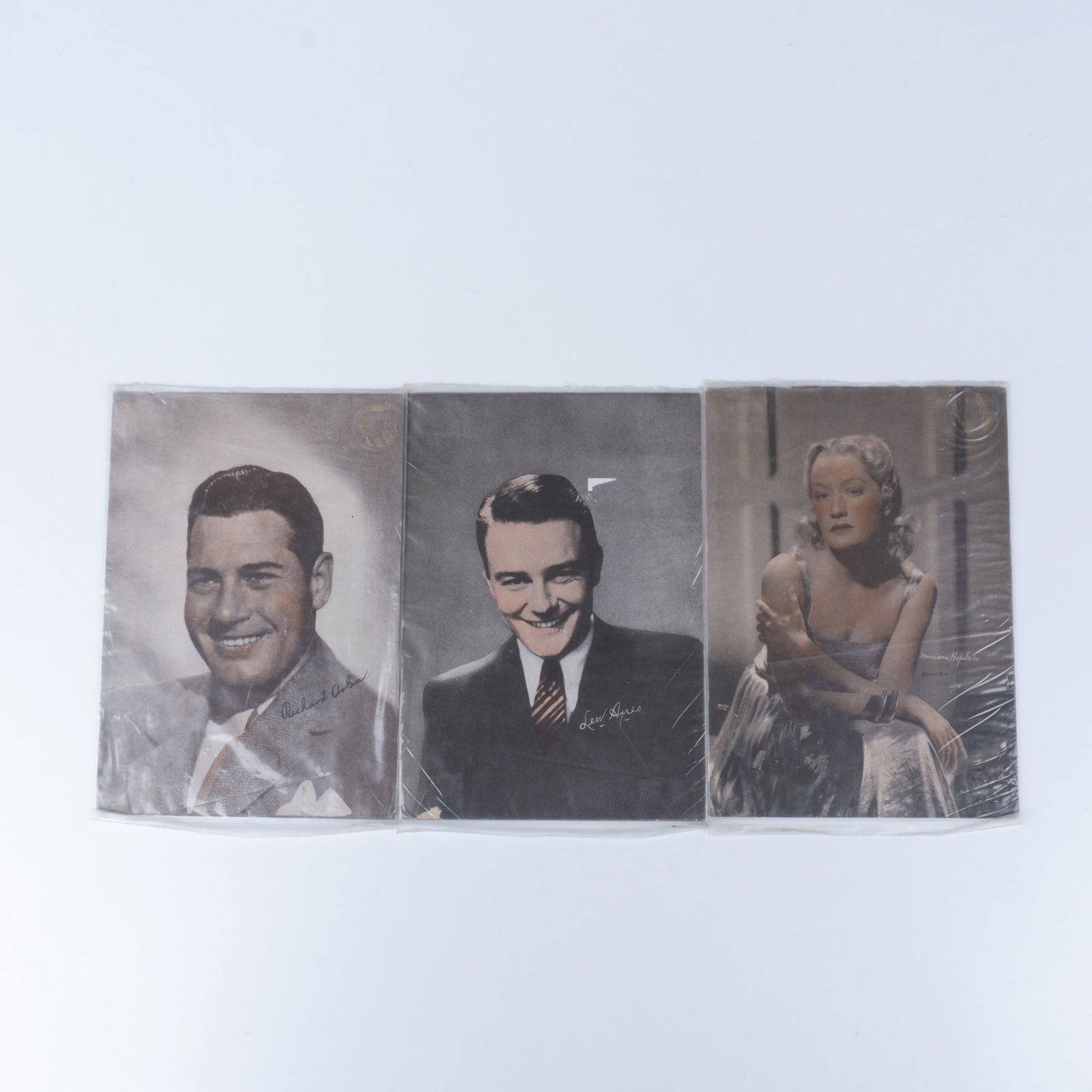 3pc Vintage Columbia Head Shots: Colorized photos of Miriam Hopkins, Lew Ayres, and Richard Arlen. Issued: Early 20th century Dimensions: 5"L x 7"W