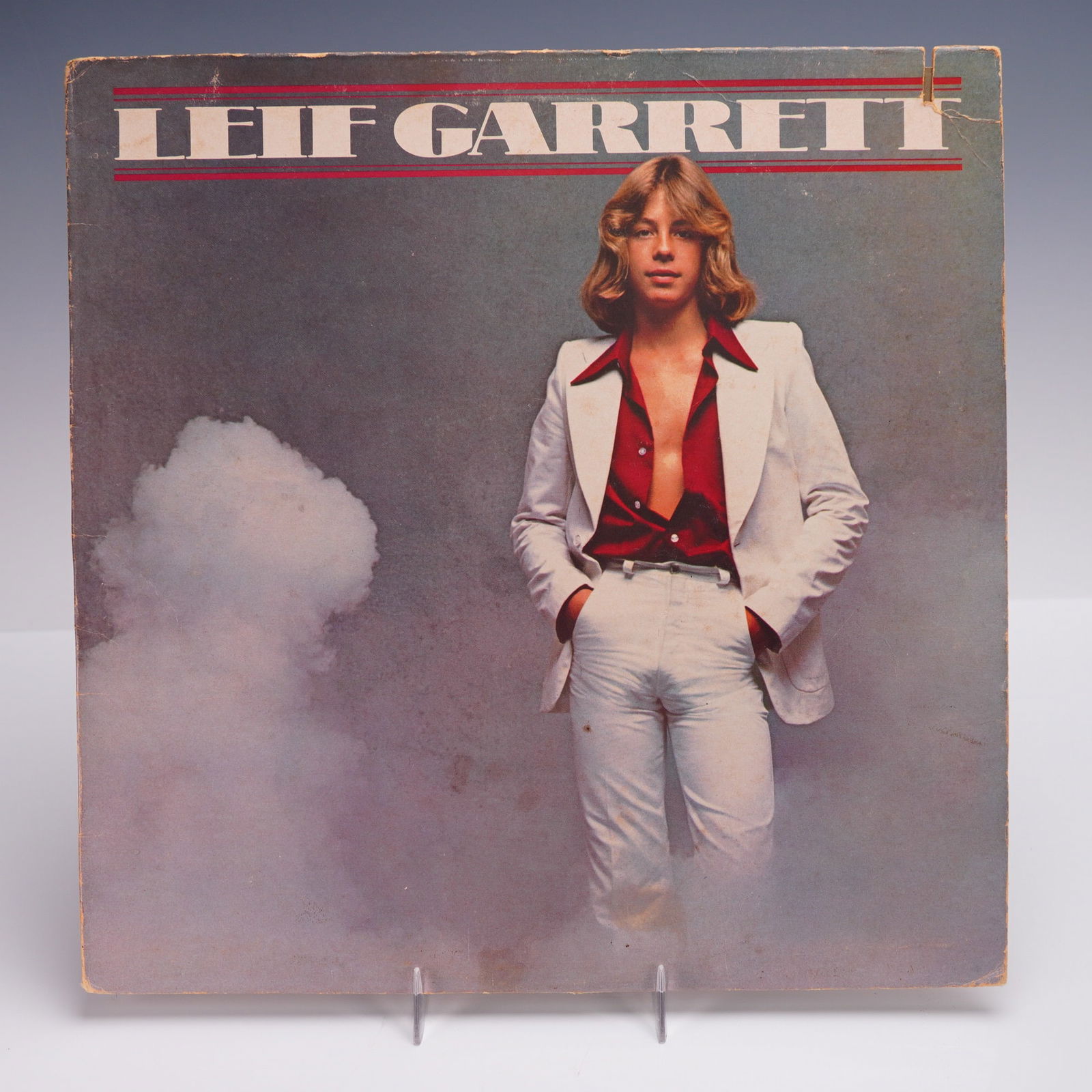 Atlantic Records Leif Garrett Vinyl Record, Leif Garrett LP: This 1977 debut studio album by teen pop idol Leif Garrett was released by Atlantic Records. The cover features a glamorized photographic portrait of Garrett in a white leisure suit against a misty st