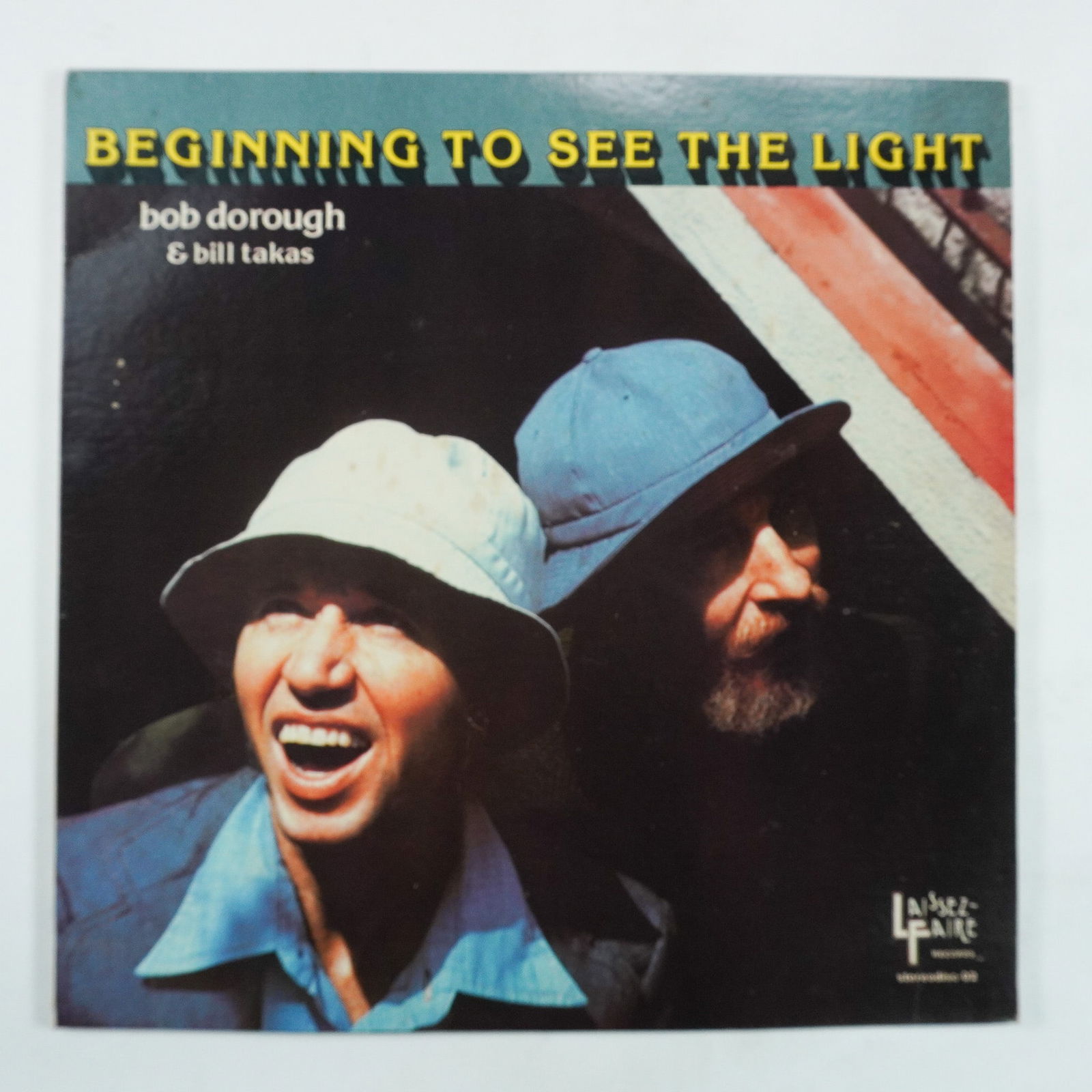 Bob Dorough & Bill Takas, Beginning to See the Light Vinyl Record: Original Beginning to See the Light vinyl record by Bob Dorough & Bill Takas, released in 1976 under Laissez-Faire Records. This jazz album features compositions by renowned artists such as Randy Newm