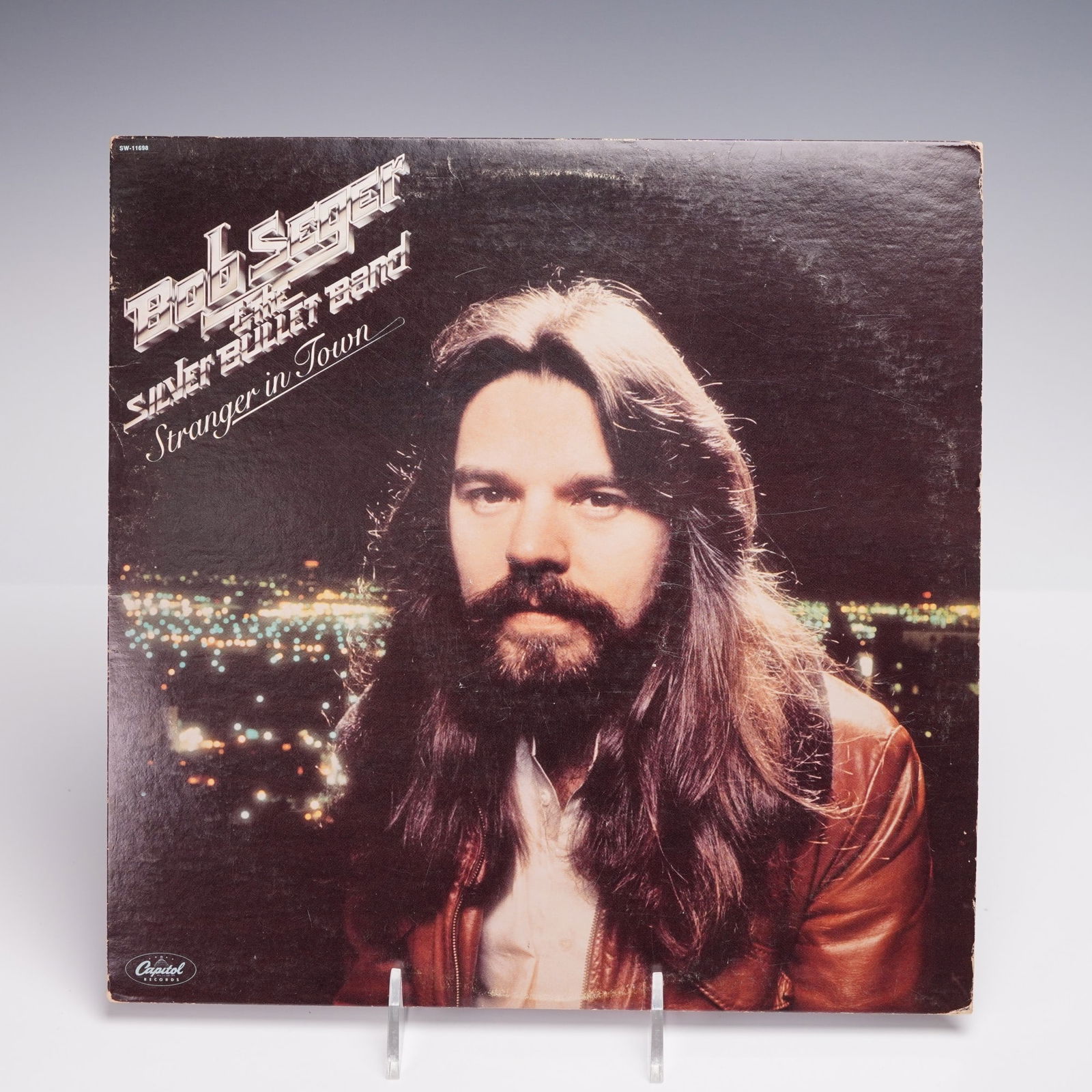Bob Seger and the Silver Bullet Band, Stranger in Town, Vinyl Record Album: Bob Seger and the Silver Bullet Band, Stranger in Town, original 1978 vinyl record album released by Capitol Records. The album cover features a striking portrait of Bob Seger with city lights in the