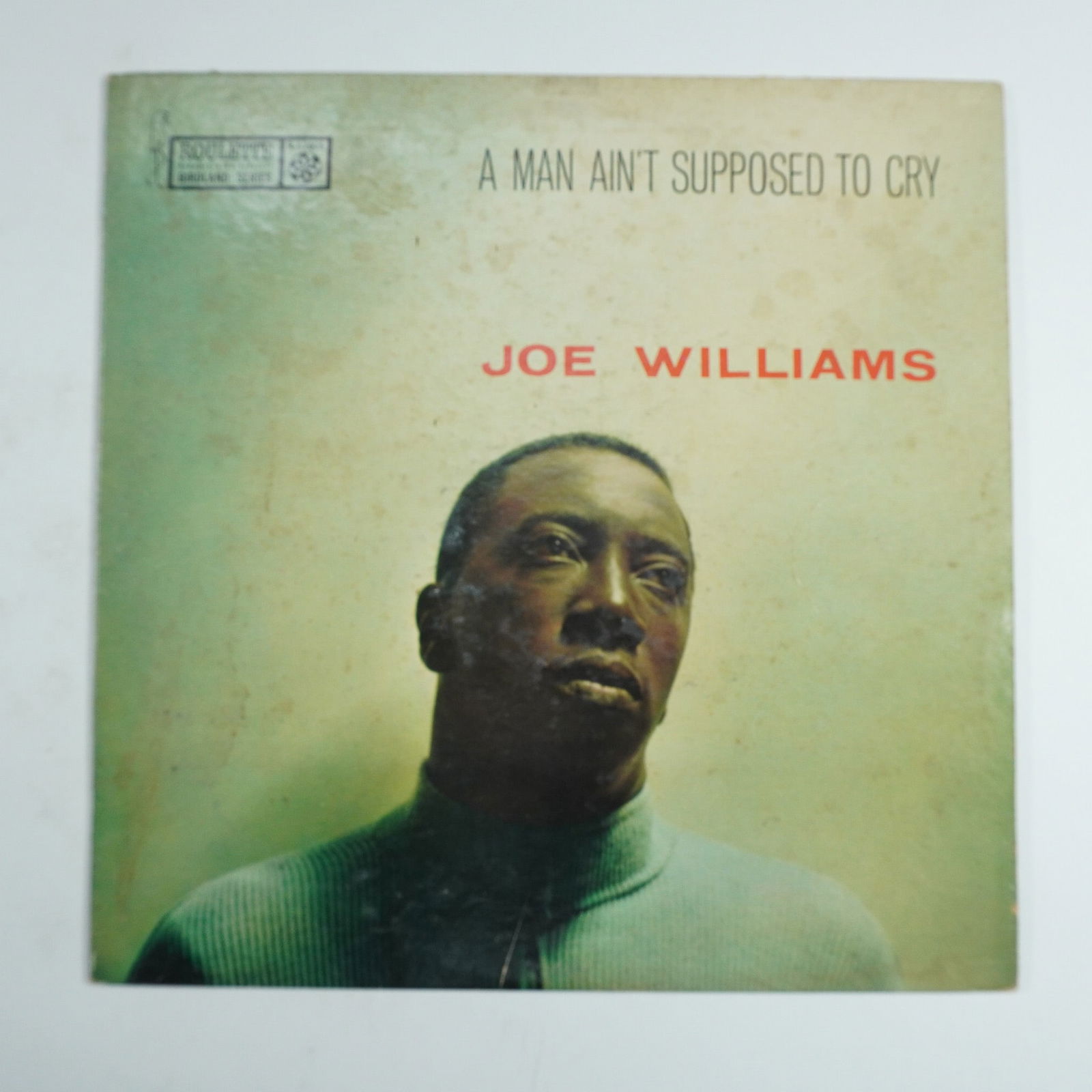 Joe Williams Vinyl Record, A Man Ain't Supposed To Cry: Vintage Roulette Records LP featuring Joe Williams with the album 'A Man Ain't Supposed to Cry', part of the Birdland series. This jazz vocal masterpiece showcases Williams' smooth, expressive bariton
