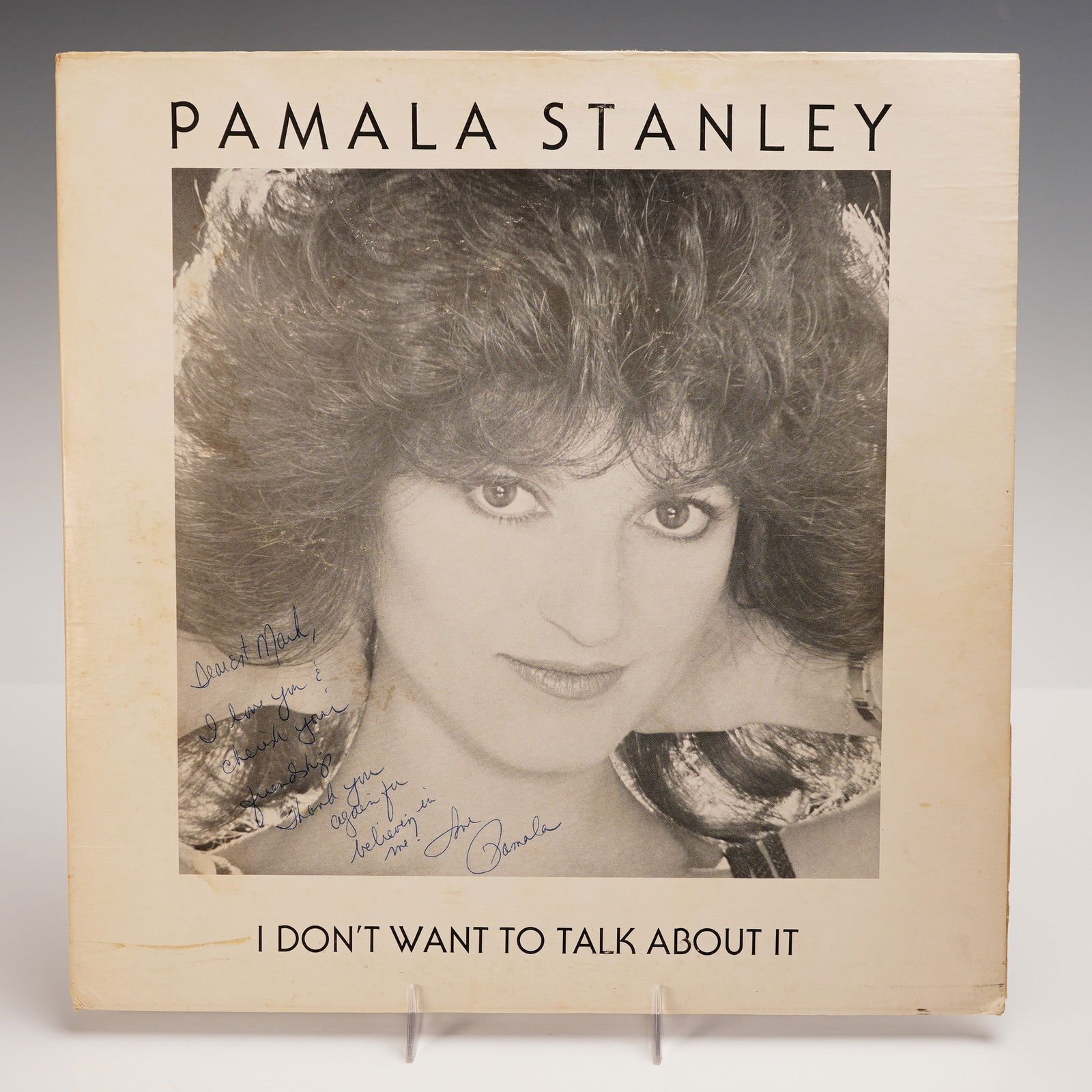 Pamala Stanley Vinyl Record, I Dont Want to Talk About It, Autographed: A 12-inch vinyl single of "I Don't Want to Talk About It" by Pamala Stanley, released in 1983 on Komander Records. The record includes the original version of the track on Side One and an "Instrumenta
