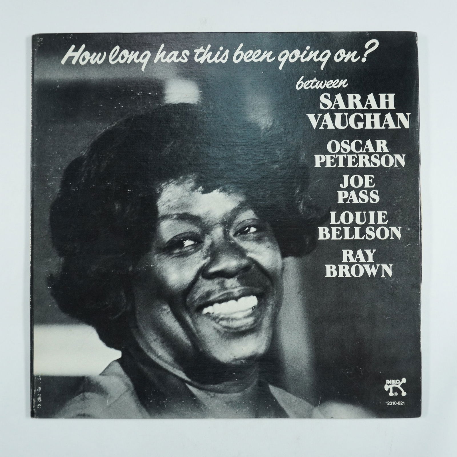 Sarah Vaughan Vinyl Record, How Long Has This Been Going On: This vinyl record, released by Pablo Records, features the legendary jazz vocalist Sarah Vaughan alongside an all-star ensemble, including Oscar Peterson on piano, Joe Pass on guitar, Louie Bellson on