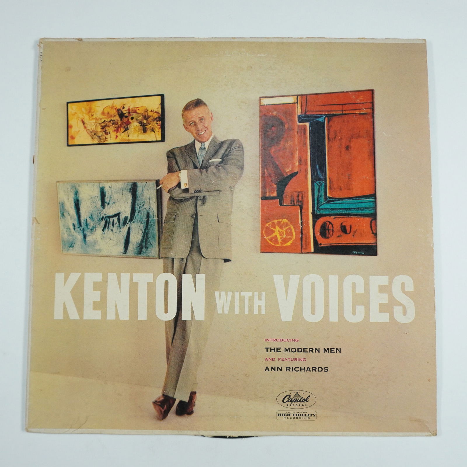 Stan Kenton Vinyl Record, Kenton with Voices: This vintage Capitol Records release, Kenton with Voices, features Stan Kenton and His Orchestra, introducing The Modern Men and featuring Ann Richards. The album presents a unique blend of Kenton's s