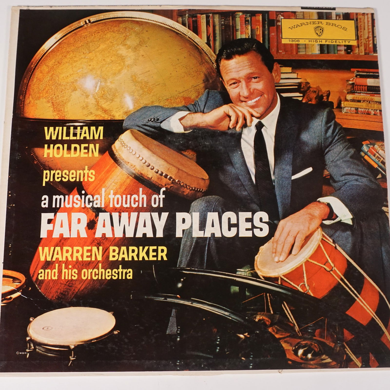 William Holden Far Away Places, Warren Barker and His Orchestra LP, B1308: This vintage LP, Far Away Places, features a unique musical compilation conducted by Warren Barker and presented by William Holden. Released by Warner Bros. Records (B1308), this record showcases inte
