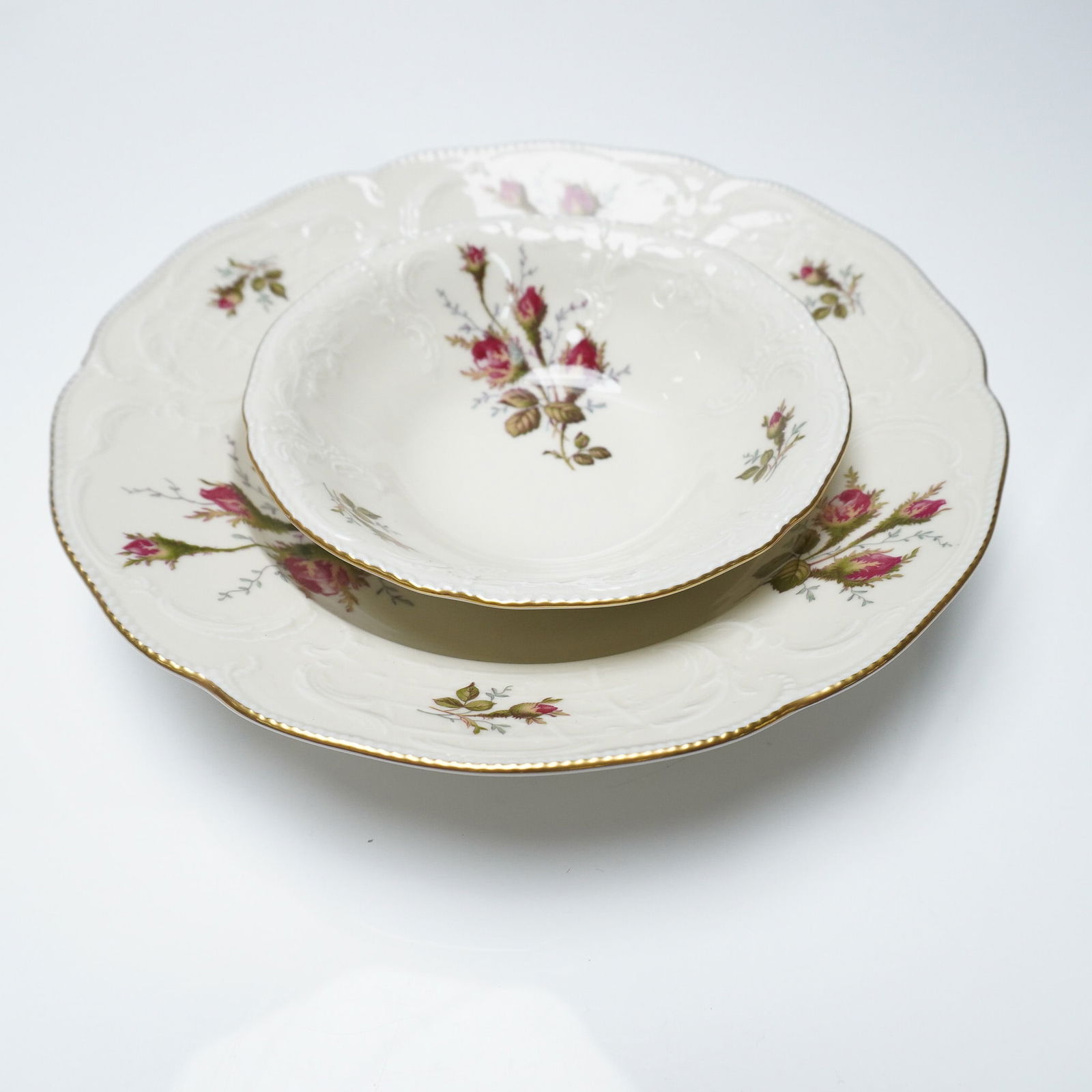 2pc Rosenthal Moss Rose Rim Soup and Cereal Bowls: Elegant 2-piece porcelain bowl set by Rosenthal in the beloved Moss Rose pattern, featuring a large rim soup bowl and a coupe-style cereal bowl. Each piece showcases detailed embossed borders and deli