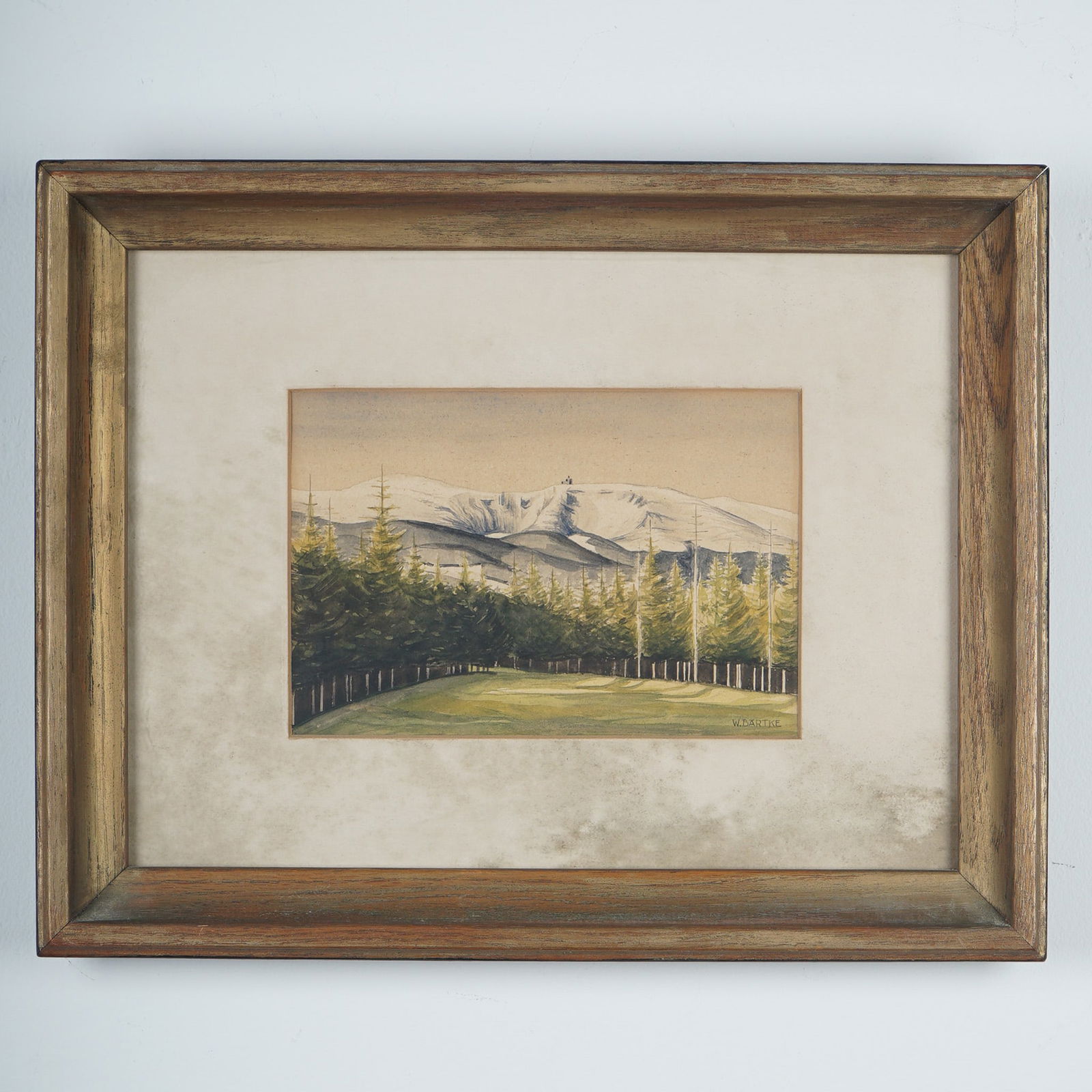 W. Bartke, Watercolor on Paper, Winter Landscapew/ Fir Trees, Signed: Watercolor landscape by artist W. Bartke, featuring a striking alpine view with a dense forest of fir trees in the foreground and snow-covered peaks rising in the background. The mountaintop is detail