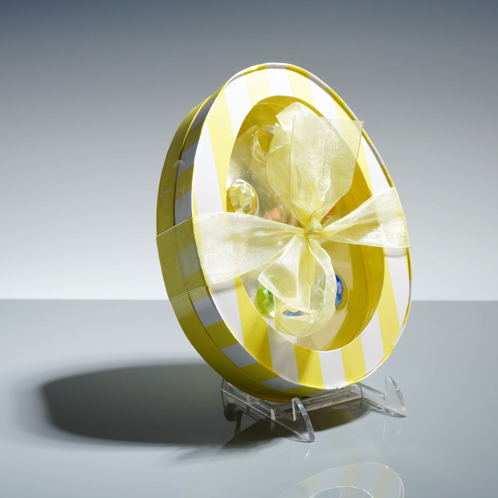 Swarovski Crystal Easter Egg Set 665193: A set of Swarovski faceted crystal ornaments in the form of eggs, identified as model 665193. The set consists of translucent crystals in various colors including blue, green, yellow, orange, and clea