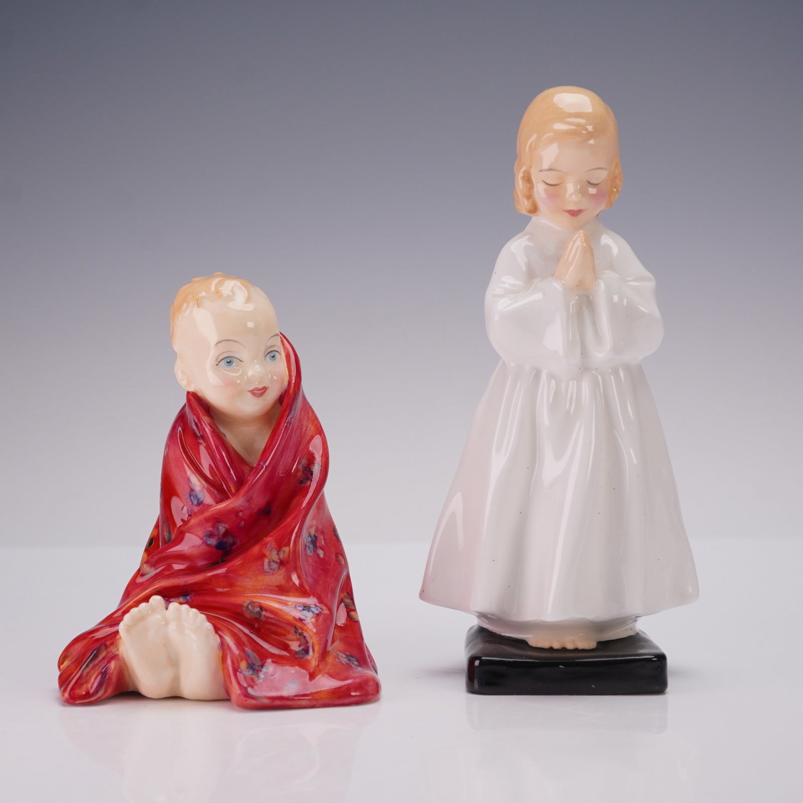 2pc Royal Doulton Figurines, HN1978, HN1793: A delightful pair of Royal Doulton figurines, "Bedtime" (HN1978) and "This Little Pig" (HN1793), showcasing the timeless charm and craftsmanship of the renowned English pottery house. "Bedtime," desig
