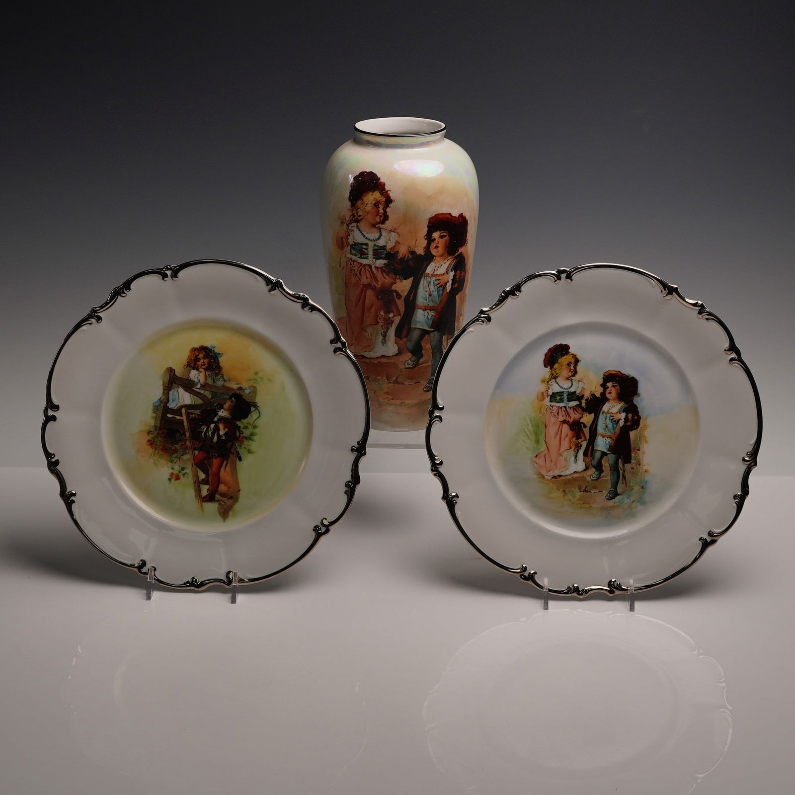 3pc Group of Hand-Painted Porcelain: Hutschenreuther Plates & ZS & Co Vase: Charming group of three early 20th century German porcelain items, including two cabinet plates by Hutschenreuther Selb, each featuring figural scenes of children in vivid polychrome enamels. Both pla