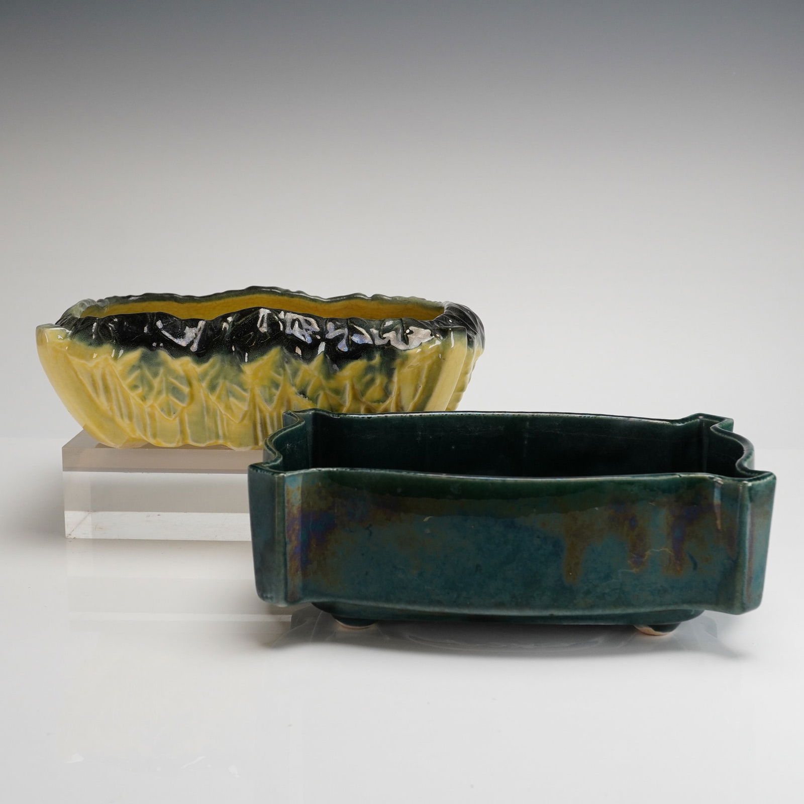 Two Mid-Century American Art Pottery Planters by McCoy and UPCO: Two American art pottery planters, comprising one piece by McCoy and one piece by UPCO (Upper Peninsula Ceramic Company). The collection includes a McCoy oval planter bowl featuring a stylized cabbage