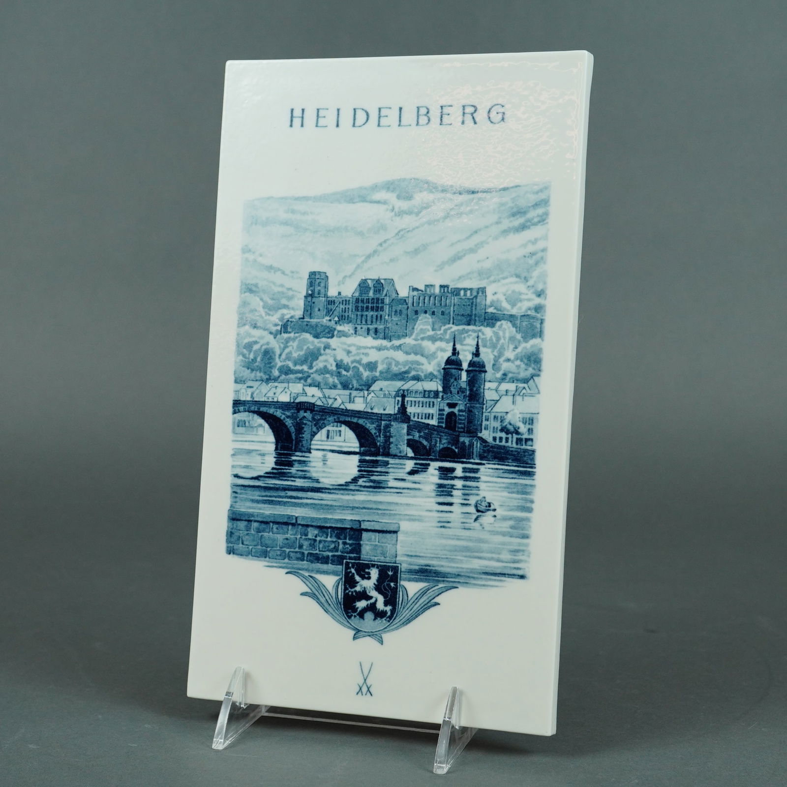 Meissen Blue and White Porcelain Plaque, Heidelberg: A rectangular white porcelain plaque with a serene city, featuring a blue transfer-printed image of the Karl Theodor Bridge (commonly called the Old Bridge) in Heidelberg, Germany. Below the scene is