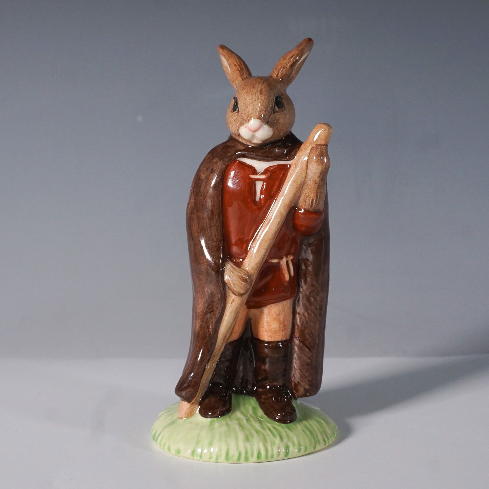 Royal Doulton Bunnykins Little John Figurine DB243: From Royal Doulton's beloved Bunnykins series, this hand-painted and hand-decorated porcelain figurine depicts Little John from The Robin Hood Collection. Designed with rich earthy tones, this charmin