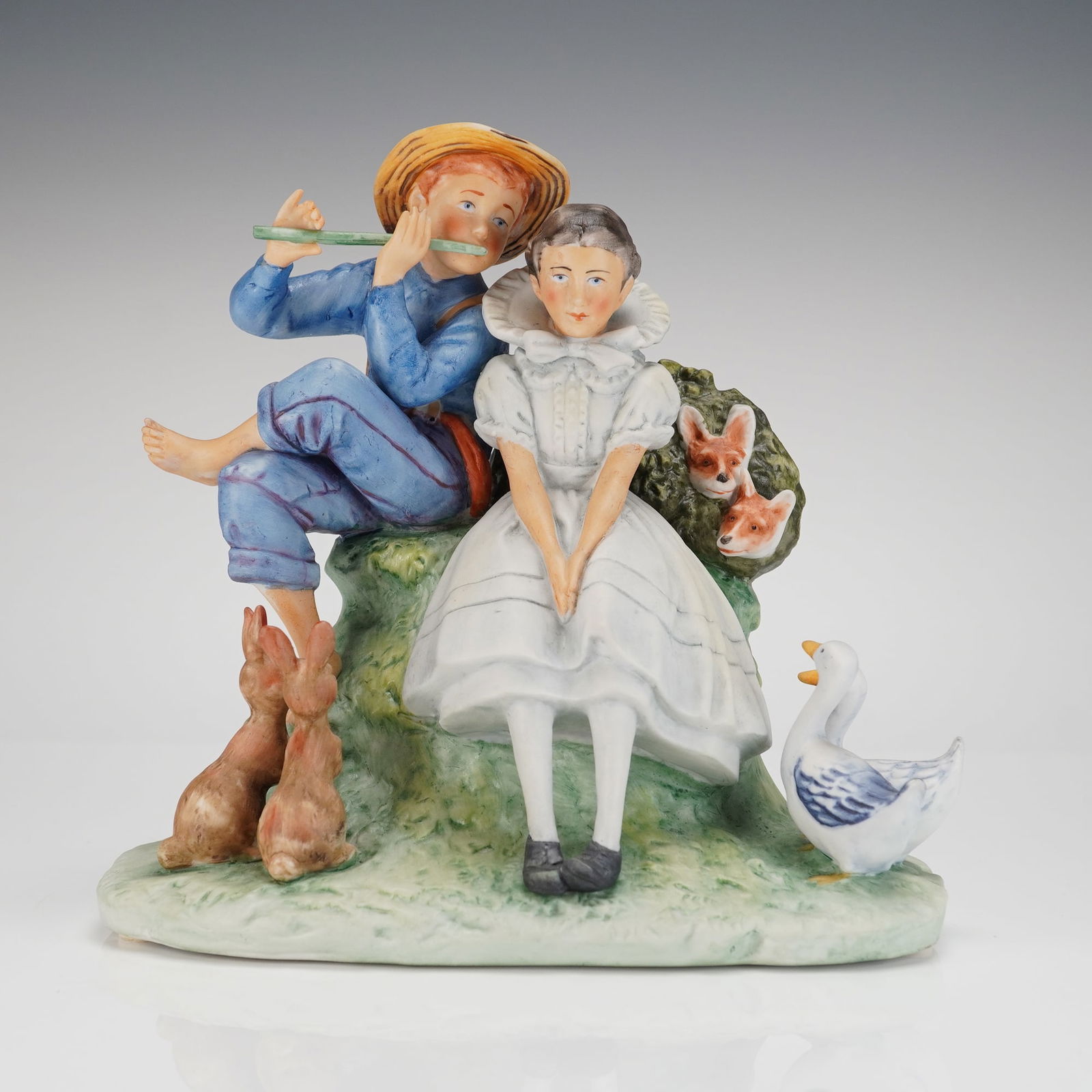 Gorham Figurine Inspired by Norman Rockwell, Sweet Song So Young: A single glazed ceramic figural group manufactured by Gorham, inspired by the illustrations of Norman Rockwell. The piece is commonly known as Sweet Song So Young, and is specifically marked as Spring