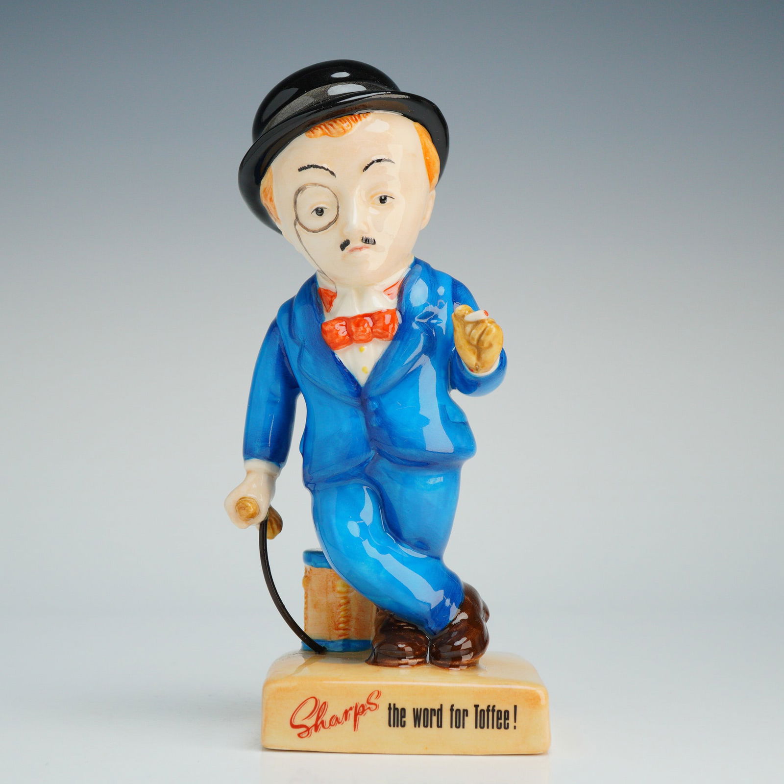 Royal Doulton Advertising Porcelain Figurine, Sir Kreemy Knut AC3: Part of the 20th Century Advertising Classics collection . This limited edition figurine, numbered 1629 of 2000, depicts the mascot for Sharps Toffee as a gentleman in a bright blue suit, red bow tie,