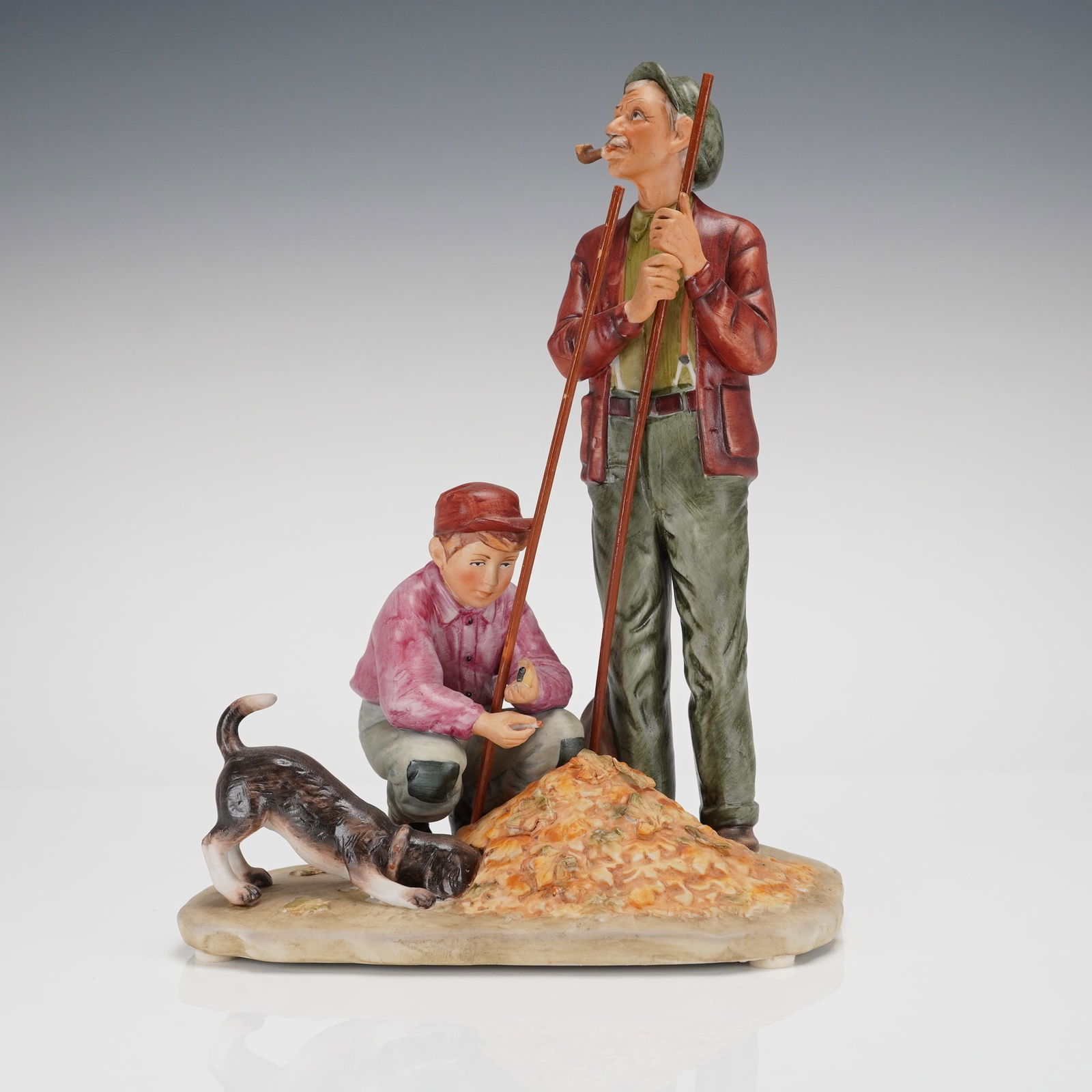Gorham Norman Rockwell Four Seasons Fall Pensive Pals Figurine: A single polychrome ceramic figurine manufactured by Gorham, inspired by Norman Rockwells 1948 Four Seasons illustration titled "Fall - Pensive Pals." The figurine depicts an older man standing with a
