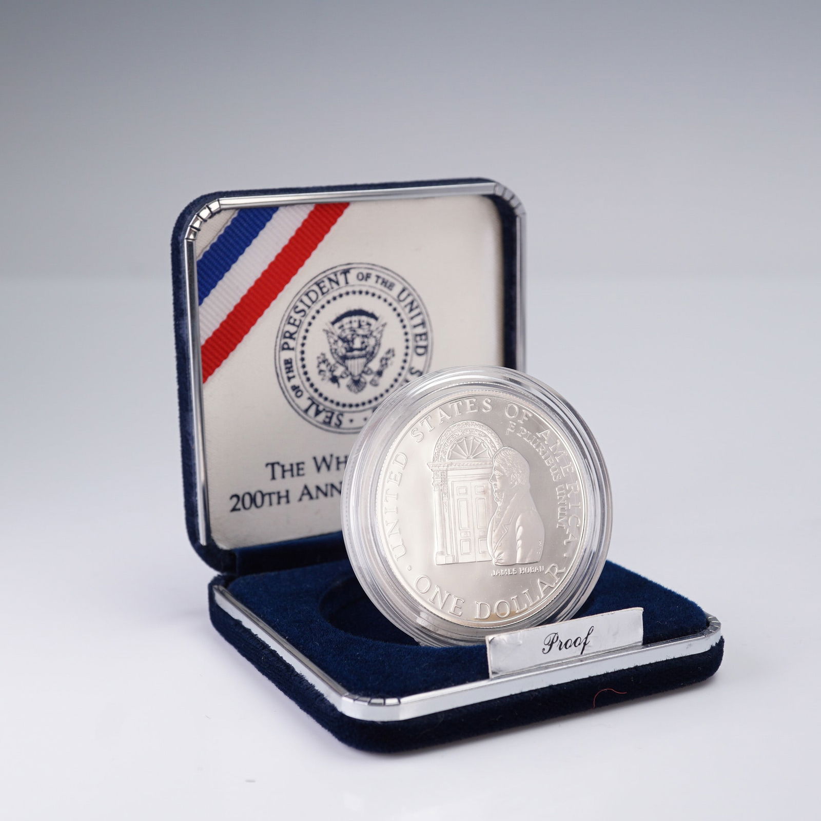 1992-W U.S. Mint White House 200th Anniversary Proof Silver Dollar: Issued by the United States Mint to commemorate the 200th anniversary of the White House, this proof silver dollar honors the enduring symbol of the American presidency. The obverse features a detaile
