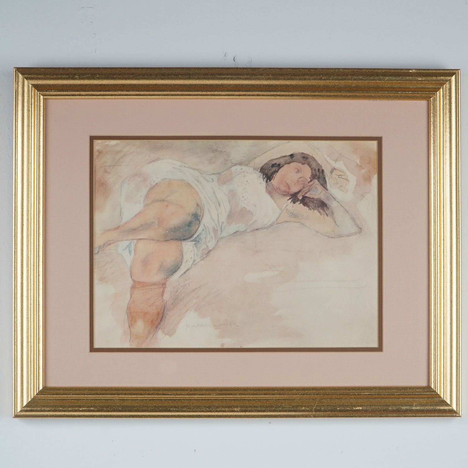 Raphael Soyer, Lithograph on Paper, Reclining Woman: Framed color lithograph depicting a reclining woman in a light slip or undergarment, rendered in soft washes of pink, beige, and blue tones. The female subject gazes outward, propped on one arm with