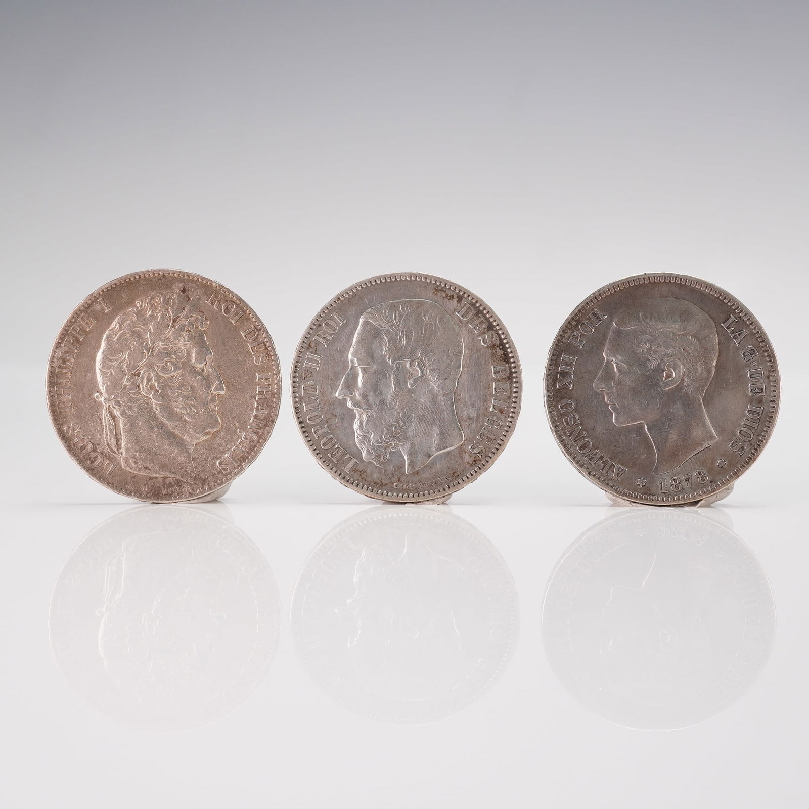 3pc 19th Century World Silver Coin Group France Belgium Spain: This three piece world coin group includes an 1845 France 5 Francs Domard type featuring Louis Philippe I with a reverse framed by a laurel and olive wreath, an 1873 Belgium 5 Francs depicting King