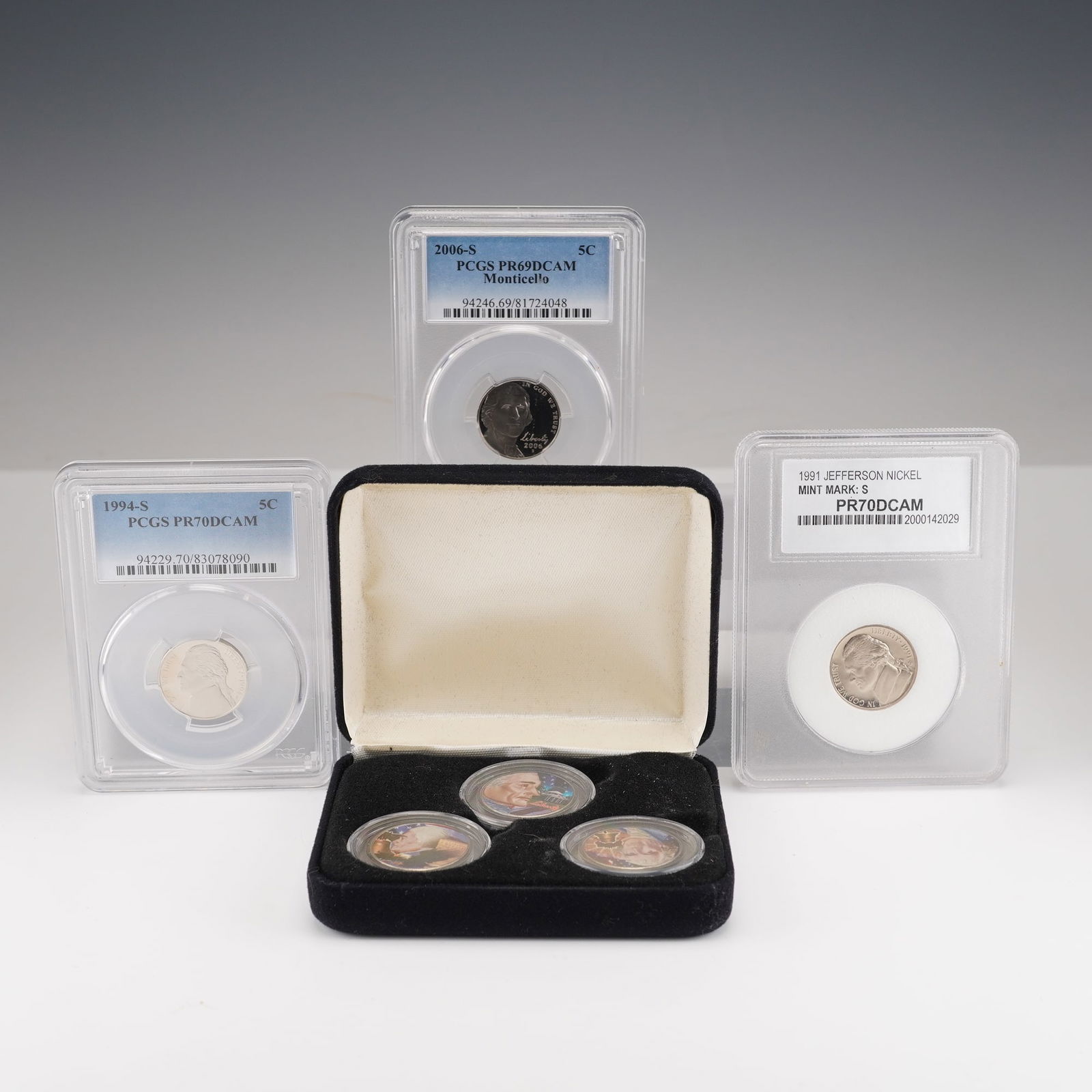 4pc 1991-2006 Jefferson Nickels and Colorized Presidential Tribute Rounds: Includes a 1991-S Jefferson Nickel PCC graded PR70 DCAM, a 1994-S Jefferson Nickel PCGS graded PR70 DCAM, and a 2006-S Jefferson Nickel, 2nd Portrait return to Monticello PCGS graded PR69DCAM. Also 