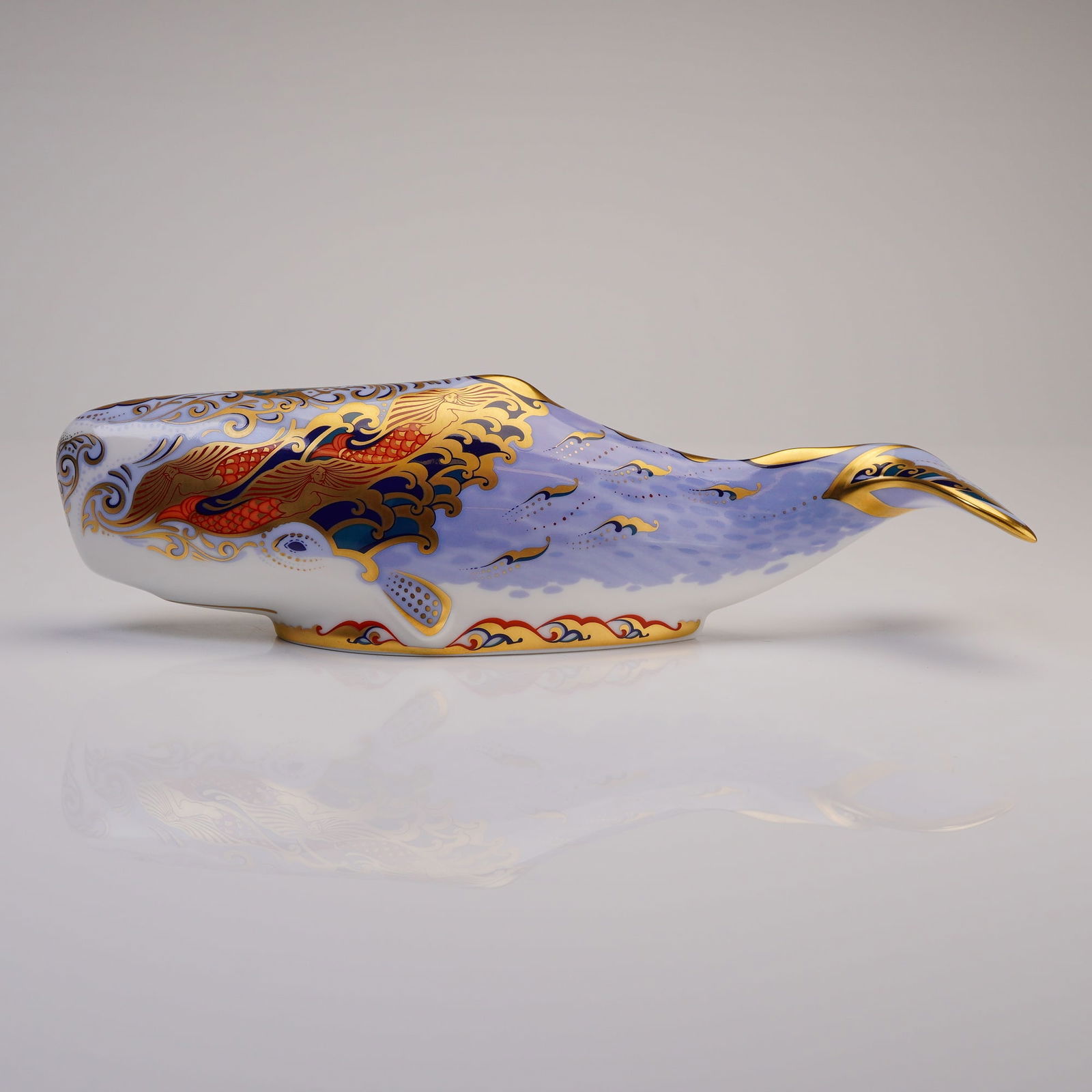 Royal Crown Derby Paperweight Oceanic Whale: A Royal Crown Derby paperweight titled Oceanic Whale, produced as an exclusive for the Royal Crown Derby Collectors Guild. This figurine is modeled as a sperm whale and constructed from English bone c