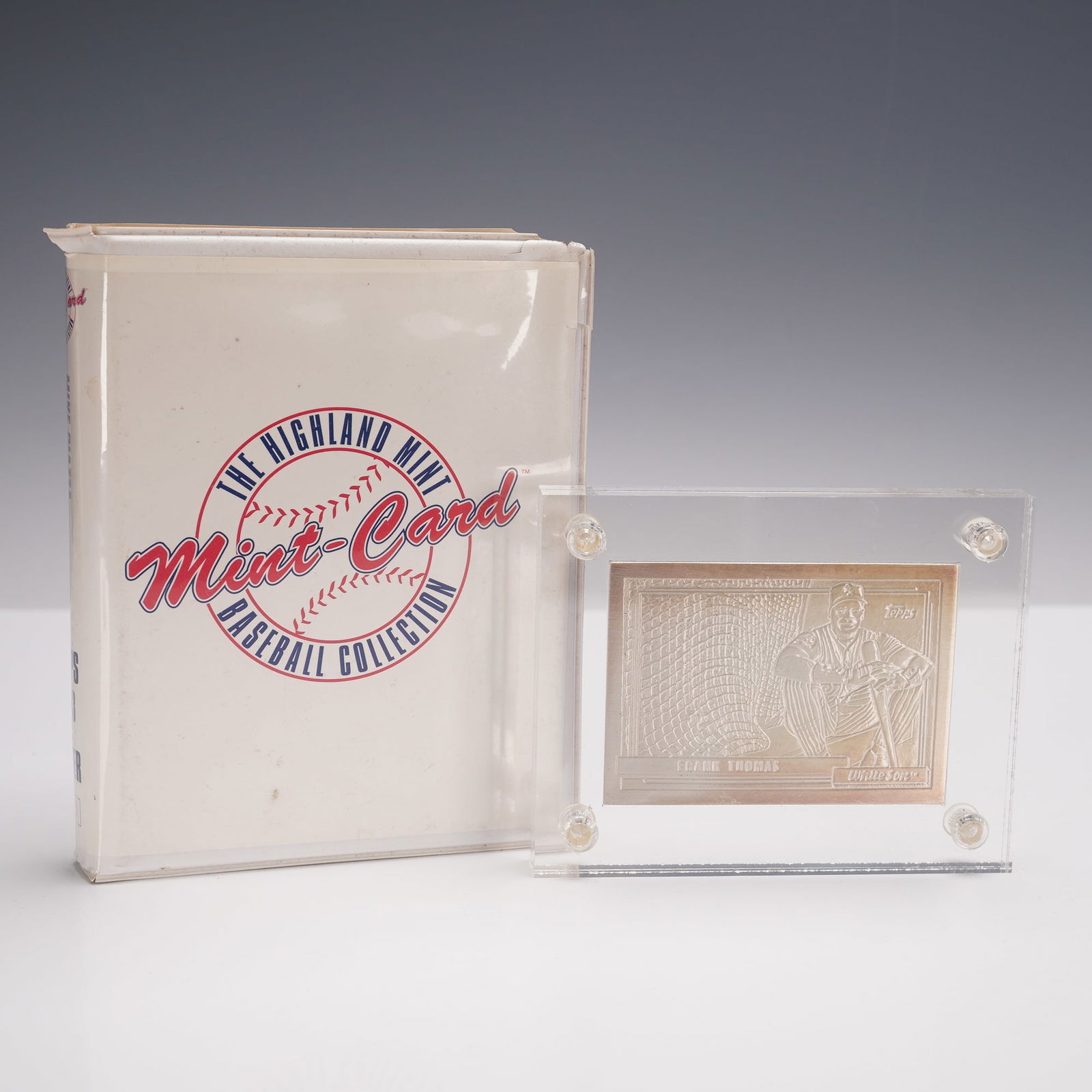 1992 Highland Mint Baseball Collection Frank Thomas 4.25 oz Silver Card: Struck in .999 fine silver with a weight of 4.25 troy ounces, this collectible piece replicates Thomas' 1992 Topps card design. The obverse depicts an engraved image of Frank Thomas in uniform with