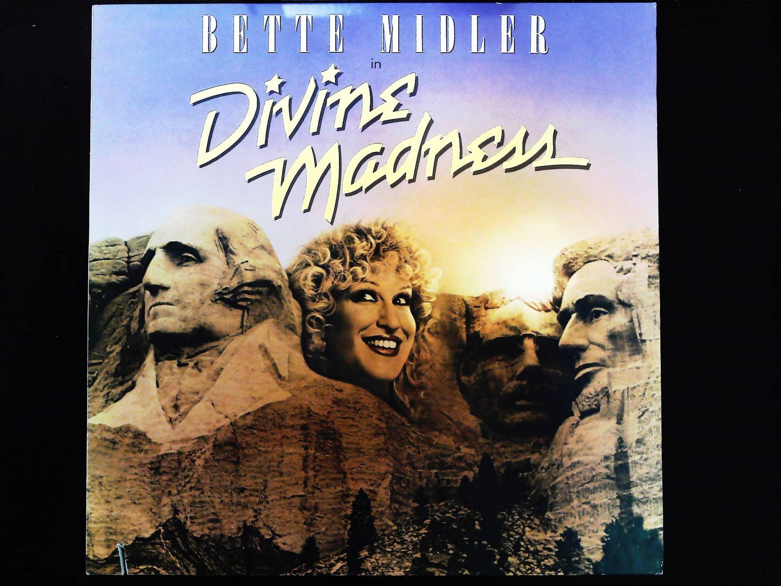 Bette Midler. Divine Madness. Atlantic Records, 1980. Original LP Record.: Bette Midler. Divine Madness. New York: Atlantic Recording Corporation, 1980. Original US release vinyl LP album (SD 16022). 12-inch 33 1/3 RPM record contained in a glossy pictorial cardboard sleeve.