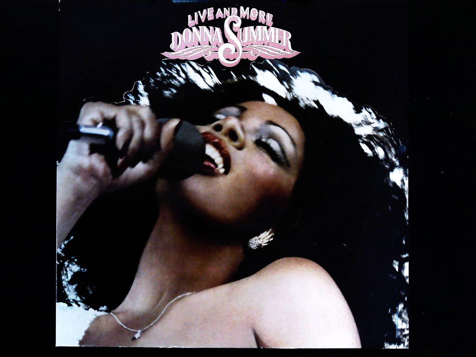 Donna Summer Live and More 2x Vinyl LP Record Album: This lot consists of one vintage vinyl LP record album, "Live and More," by Donna Summer. Research confirms this album was originally released as a double vinyl LP set (2x LP). The album is representa