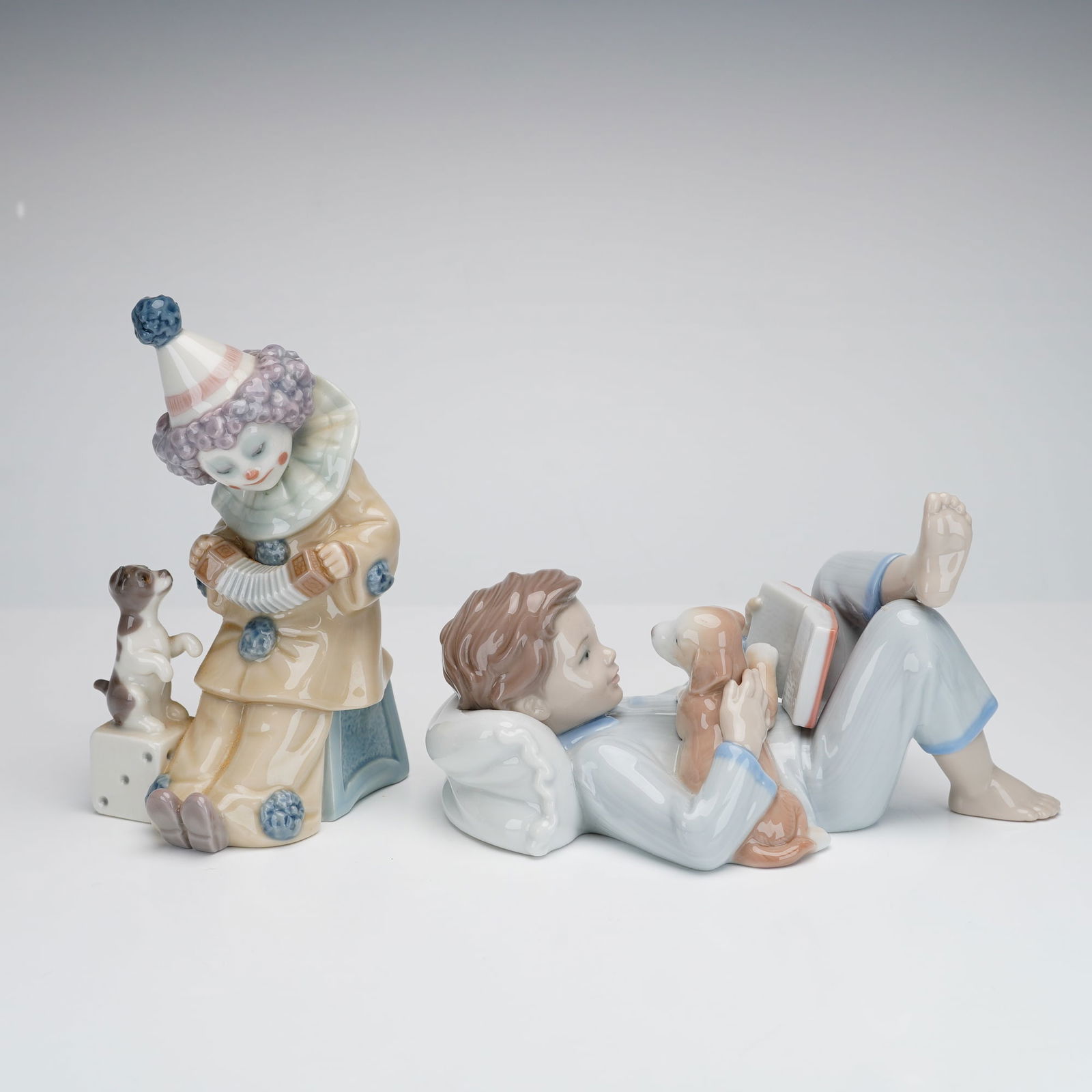 2pc Lladro Figurines, Pierrot with Concertina, and Shall I Read You a Story (1 of 3)