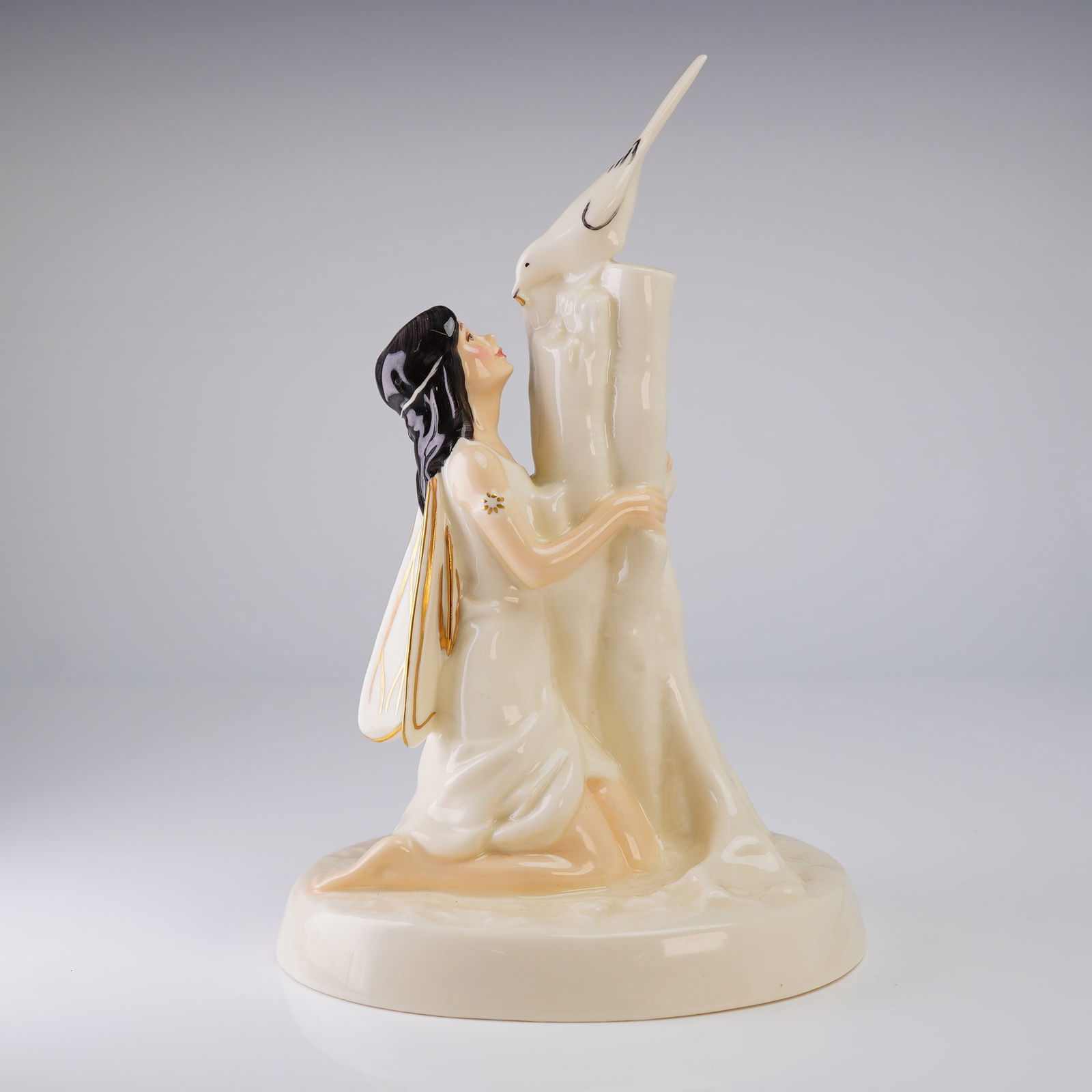 Royal Doulton Enchantment Collection Figurine Magpie Ring HN2978: A Royal Doulton decorative figurine, titled The Magpie Ring, model number HN 2978, belonging to the Enchantment Collection. The piece is crafted from glazed bone china and dates to 1983. The figure de