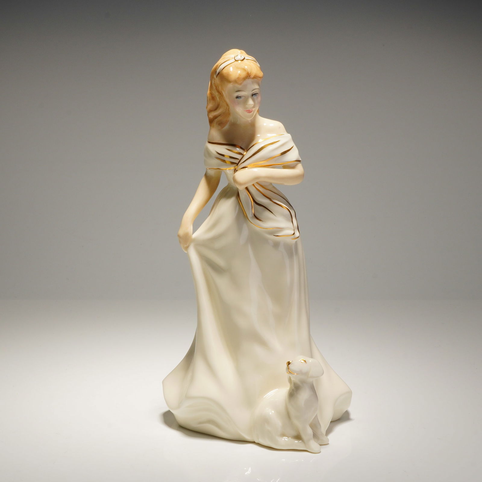 Royal Doulton Morning Walk HN 3860 Figurine: A Royal Doulton figurine titled Morning Walk, model number HN 3860. This glazed bone china piece was modeled by Timothy Potts and carries a 1996 copyright. The figure depicts a standing woman wearing
