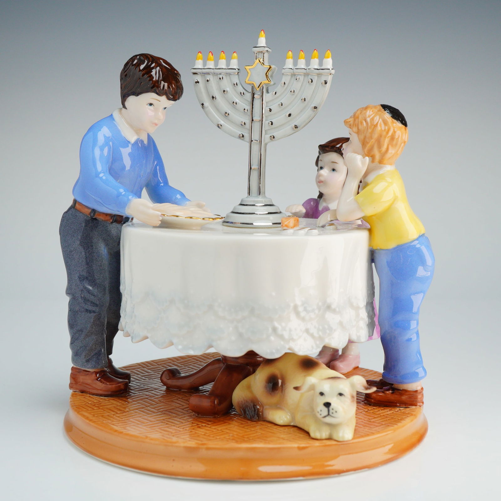 Royal Doulton Miracle of Light Figurine HN 4947: Royal Doulton Holiday Traditions Collection Miracle of Light porcelain figurine, model number HN 4947. This hand-made and hand-decorated item features a scene of three children and a dog positioned ar