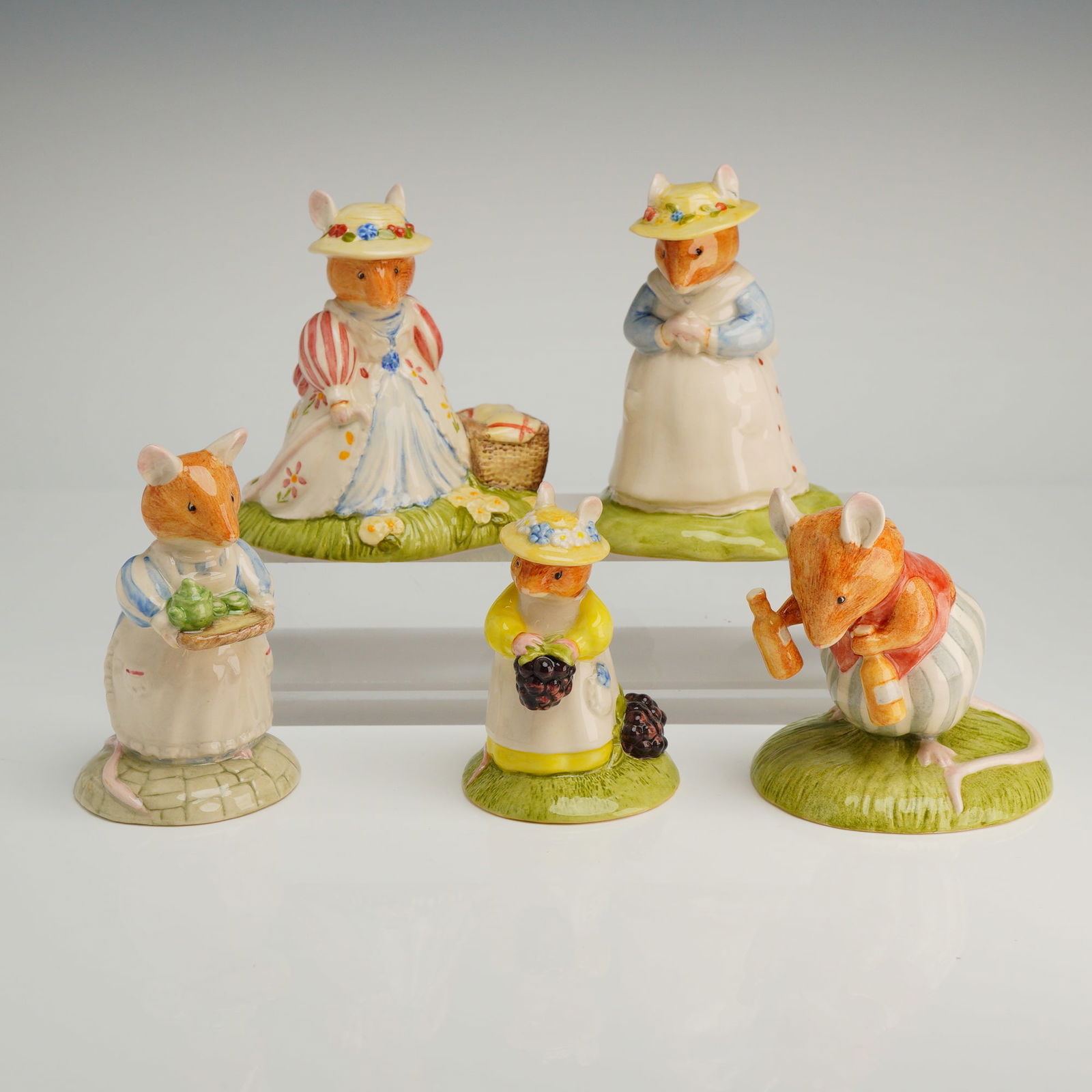 Collection of Five Royal Doulton Brambly Hedge Figurines: A collection of five 5pc Royal Doulton porcelain Brambly Hedge figurines, including Lady Woodmouse, Mrs Apple, Primrose Picking Berries, Basil, and Poppy Eyebright, marked "HAND MADE AND HAND DECORATE